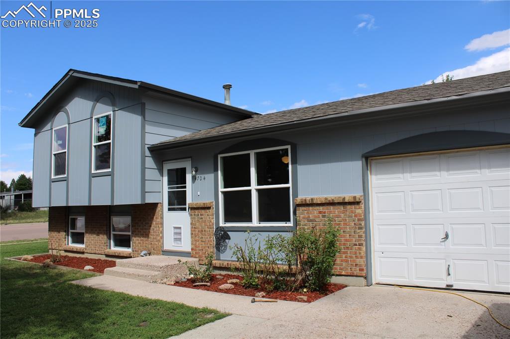Adorable 4 bed, 2 bath home that has been newly painted and newly carpeted.  The upper bedrooms are very spacious and there are 2 bedrooms in the lower level with each floor having its own full bath.  Brand new vinyl windows have been installed along with a new electrical panel.  Almost a 1/4 of an acre is yours with beautiful mature trees and a spinkler system for the front to keep the grass green!  You will have quick access to Peterson Space Force Base and the Powers corridor offering plenty of things to do.  This property provides some extra room for an RV or trailer parking alongside the 1-car garage.  Please take a look, you could move in immediately!
