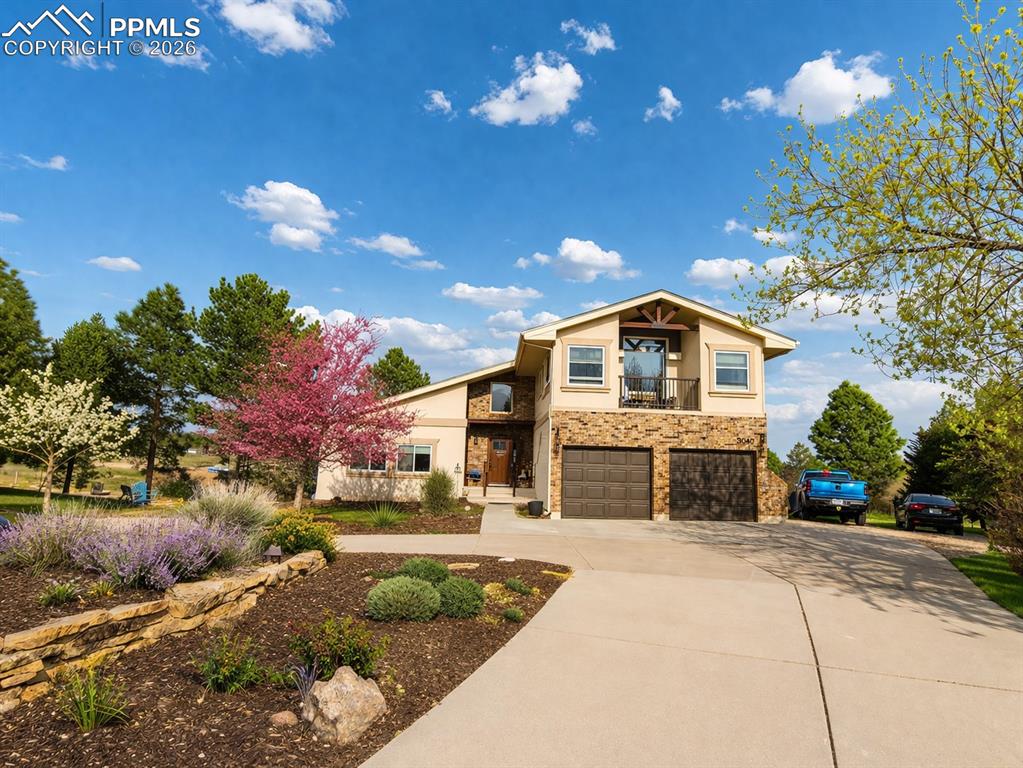 Set on 2.3 acres, this home offers the the kind of space that’s getting harder to find. Room for a large family to spread out, and plenty of parking for vehicles, trailers, or outdoor gear. Wake up to a direct view of Pikes Peak from your primary bedroom. You’re just minutes from downtown, but it feels removed from the noise, with a quiet cul-de-sac setting and open views of the mountains. It’s an easy place to slow down and enjoy where you live. There’s direct access to nearby hiking trails, making it simple to get outside without having to drive anywhere. The lower-level walk-out includes a separate living area, giving you options for family, guests or private quarters. There is a large storage shed as well as a 10x20 heated shop, ready for all of your projects. A practical layout, usable land, and a location that balances convenience with a more rural feel.