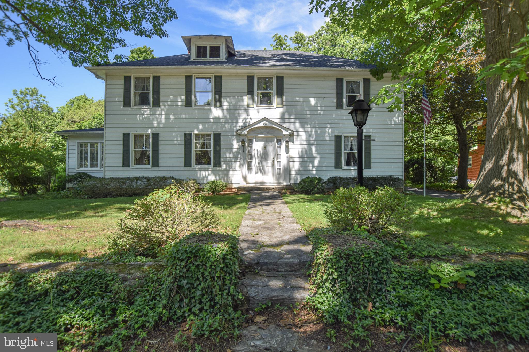 PRICE IMPROVEMENT!      Welcome to 432 South Church Street in Shepherdstown, West Virginia — a charming Colonial Revival home on a half-acre lot in the heart of town. This is your opportunity to own a spacious lot just outside of town limits.  A piece of history, this home has been owned by the same family for almost 90 years!  Inside, hardwood floors run throughout the main living spaces. The large family room includes a fireplace converted for a wood stove, while the formal living room features a beautiful mantel and connects to the dining room and sunroom, creating an inviting space for entertaining or relaxing. Large windows and the sunroom fill the home with natural light.The kitchen offers stainless steel appliances, an island, a casual dining area, and a walk-in pantry.Upstairs, you’ll find 5 generously sized bedrooms, including a large primary suite with a private bath and cedar closet. The second floor also includes a home office, playroom, and full bathroom. Hardwood floors are located beneath the carpet in three bedrooms and the office.Additional features include a finished basement ideal for a home gym, a large attic for storage, and a detached shed/garage.Outside, enjoy mature trees, beautiful landscaping, spring blooms, hardscaping, and a large screened porch overlooking the private yard.Located in a peaceful setting just steps from dining, shopping, recreation, entertainment, and Shepherd University.
