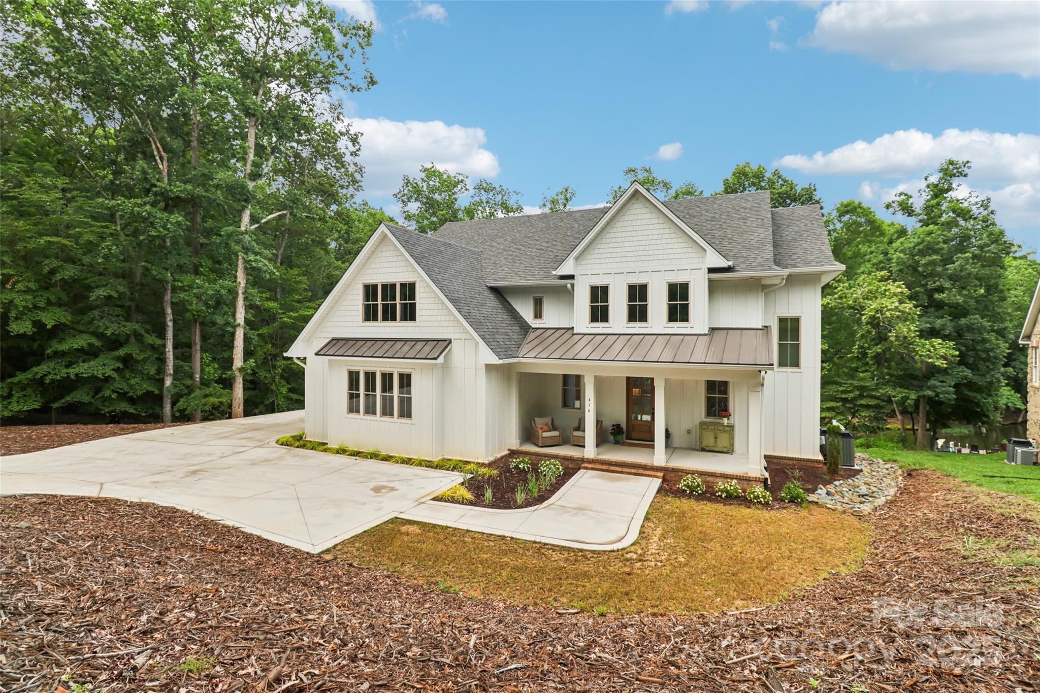 This new custom-built home is nestled in a secluded cove within Swift Island gated community. This stunning property offers luxury, comfort, and direct access to the serene 5,000-acre Lake Tillery.

The open living space flows onto a spacious deck with breathtaking lake views. The main floor features a powder room, living area with fireplace and custom built-ins, and a high-end kitchen with a large island and a walk-in pantry & en suite bedroom.

Upstairs, the owner's suite with an oversized bathroom, a freestanding tub, a private shower, a separate toilet room, and walk-in closet. Large glass doors open to a private deck. Two additional bedrooms with private bathrooms. A large flex space is perfect for a den or home office, and laundry room.

Lower level featuring a large den with a summer kitchen & island, workout room, 4th bedroom with a large closet and full bathroom, and a generous shower area for post-swim rinses. Another large flex space is ready for your dream sauna.