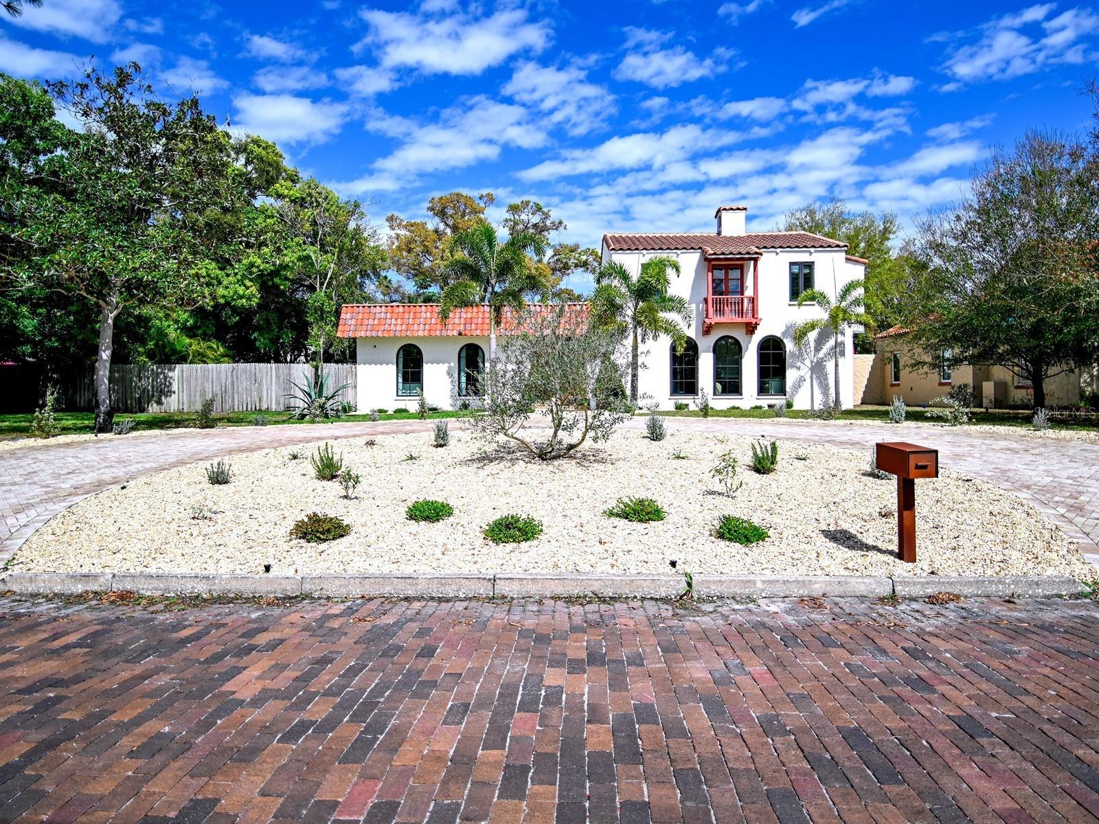 One or more photo(s) has been virtually staged. Welcome to a beautifully reimagined piece of Gulfport history in Pasadena Estates—a 1920s Spanish-Mediterranean gem on a sprawling 1/3-acre lot. Meticulously restored, this residence honors its architectural heritage w/ original arches, beamed vaulted ceilings & exquisite woodwork throughout, complemented by deco-stucco interior walls. Featuring beautiful hardwood floors alongside elegant wood-look tile, every room radiates warmth and style. W/ 3-4 beds & 2 full/2 half baths, it artfully blends thoughtful, high-end renovations for modern comfort while retaining its historic charm. Venture through the grand foyer into a sun-drenched formal parlor anchored by a classic wood-burning fireplace and handcrafted details, incl. authentic corbels & exposed beams. Entertain in elegance in the formal dining rm, which features a stunning crystal chandelier & opens through French doors to a picturesque Spanish courtyard w/ a tranquil old-world fountain. The chef's kitchen is a showstopper w/ wood cabinetry, granite counters, premium appliances incl. a new 2026 dishwasher, designer lighting & a luxurious quartz island. A spacious Butler's Pantry connects directly to a powder rm, complete w/ a well-appointed wet bar & fridge—perfect for entertaining guests or hosting special occasions. Adjacent spaces incl. a mudroom w/ updated electrical panel (2020), a 4th bed/flex rm, cleverly concealed laundry closet & half bath. The family rm features shiplap built-ins & seamless indoor-outdoor living. The sparkling saltwater pool was resurfaced less than a yr. ago, w/ a new pump & saltwater system replaced in 2023. Enjoy the lovely, landscaped grounds & a firepit set on easy-maintenance artificial turf. Upstairs, the renovated primary suite is a sanctuary, boasting a spa-inspired bath w/ Italian Carrara marble, custom glass & a designer double vanity, plus an expertly crafted dressing closet. Add'l rms retain vintage charm w/ original fixtures & a restored cast-iron tub. Recent upgrades—incl. a new 2025 roof, hurricane-rated doors, new 2nd-fl. A/C (July 2025), serviced & inspected downstairs A/C, Renewal by Andersen® windows, spray foam insulation, updated plumbing & more—ensure lasting peace of mind for buyers seeking a move-in ready, storm-ready historic home in Gulfport, FL. The property also offers natural gas—a valuable feature for buyers seeking energy flexibility & efficiency. Uninterrupted Terminix pest control service since purchase provides an additional layer of protection and confidence for the next owner. The current owners beautifully redesigned the front w/ landscaping & brick pavers, creating a welcoming circular drive & convenient guest parking. The detached 2-car garage offers the owners exclusive rear-entry access—perfect for added privacy and ease—and is equipped w/ 2 add'l electrical panels. All of this is just mins. from Gulfport Beach, St. Pete Beach, Pasadena Yacht & Country Club & downtown St. Petersburg. Nestled in the heart of Gulfport, FL—known for its small-town charm & vibrant local culture—enjoy tree-lined streets, art galleries, shops & eateries. Gulfport Beach and the Recreation Center are nearby for swimming & kayaking, and parks offer scenic views & outdoor activities. Year-round events like art fairs & farmers' markets, Maynard Duryea Bayview Park & Treasure Island Beach are just a short drive away.