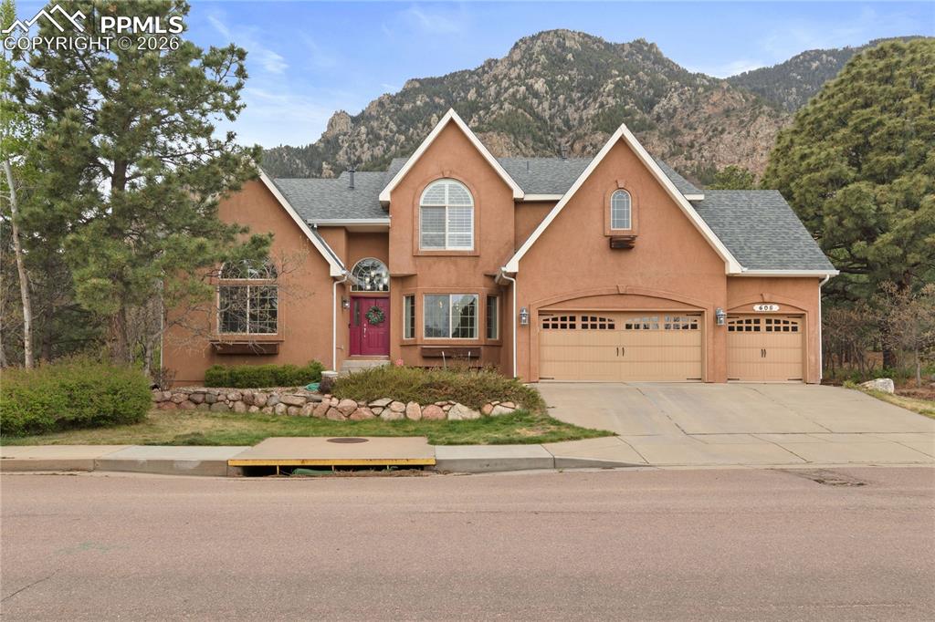 **ADDITIONAL PHOTOS COMING SOON** Tucked into the prestigious Broadmoor Stonecliff enclave, where the city gently yields to the rugged poetry of Cheyenne Mountain, this extraordinary six-bedroom, four-bathroom estate offers a rare kind of luxury—one that feels both elevated and untamed. With no rear neighbors and the foothills as your backdrop, the setting alone feels like a private retreat carved from Colorado’s natural canvas. Inside, nearly every inch has been thoughtfully reimagined, blending modern sophistication with warm, grounded textures. Wide plank hardwood floors guide you through an expansive layout featuring a refined office, elegant formal dining room, inviting breakfast nook, and a showstopping gourmet kitchen outfitted with rich walnut cabinetry, quartz countertops, and premium Thermador stainless steel appliances including a double oven, alongside a built-in Miele coffee maker for café-level mornings. The heart of the home is anchored by a striking stacked stone, double-sided fireplace connecting the kitchen and living room, while the primary suite elevates relaxation with a beautifully remodeled spa-like bath and its own private fireplace. Five of the six bedrooms feature walk-in closets, offering exceptional storage and comfort throughout. Entertainment flows effortlessly with a dedicated theater room and spacious recreation room, while outside, a composite deck equipped with natural gas lines for both a fire feature and grill sets the stage for unforgettable evenings under open skies. A charming playhouse and basketball hoop add a touch of whimsy to the grounds, rounding out a home that masterfully balances luxury, comfort, and a sense of adventure just beyond your back door.