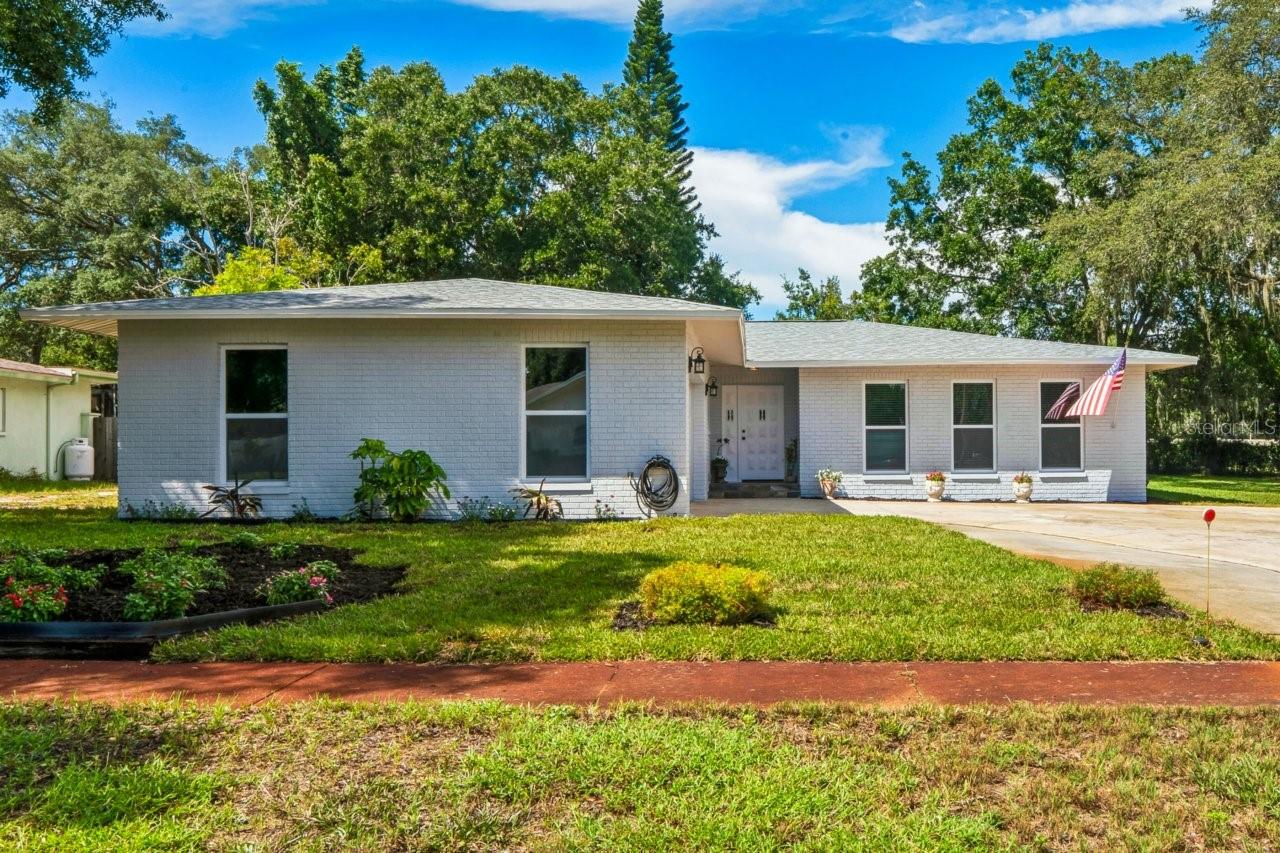 Welcome to 1131 Lancer Ln., a beautiful maintained 4-bedroom, 2-bath pool home offering 2,425 heated sqft on an oversized .32 acre cul-de-sac lot. Lovingly cared for by the original owner, this masonry brick home combines space, character, and an impressive list of recent improvements, including a 2025 ROOF, 2026 IMPACT WINDOWS AND SLIDERS, 2026 FRENCH DOORS W/ BUILT-IN BLINDS, 2023 PLUMBING/PIPES, 2024 FLOORING, 2022 POOL PUMP AND MOTOR, AND FRESH INTERIOR AND EXTERIOR PAINT. The spacious layout features a separate dining area, family room, inside laundry, and a PRIVATE BACKYARD built for Florida living with an in-ground fiberglass POOL. An approximately 90-foot-deep IRRIGATION WELL helps maintain the property with zero maintenance to date. The majority of furnishings are included, along with the 75-inch TV, making this home an exceptional opportunity for a move-in ready Florida lifestyle. Located in FLOOD ZONE X with an optional HOA of just $120 Annually, this GOLF CART FRIENDLY COMMUNITY puts you close to the best of Tarpon Springs Living, including 2 Local Beaches, the Pinellas Bike Trail, Grade-A Schools, shopping, dining, and the charm of Historic Downtown Tarpon Springs and the World Famous Sponge Docks.
