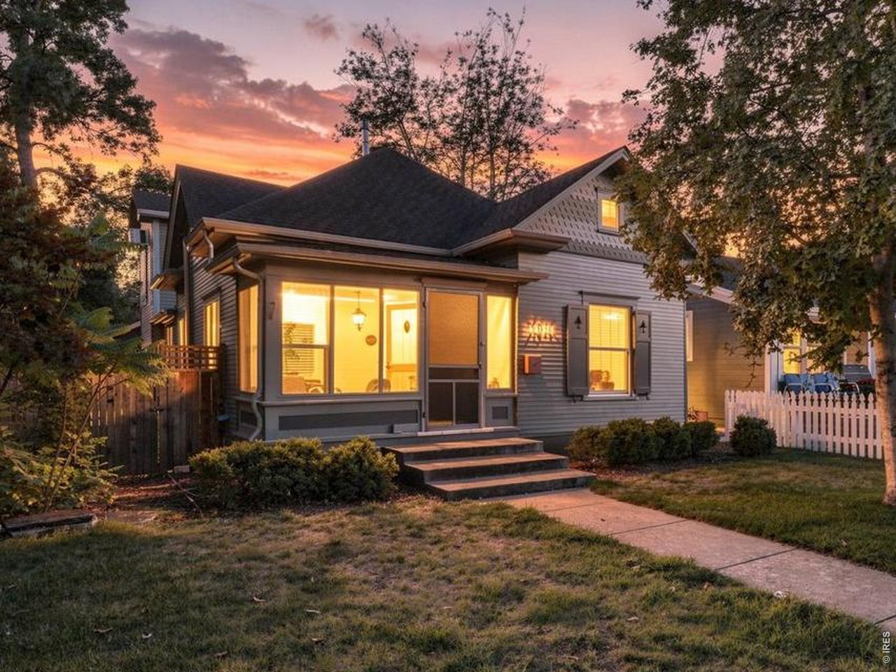 Some houses just have the kind of character that can't be built new. This charming Mountain Avenue home is one of them. Set in the lovely, history rich Washington Place neighborhood of Fort Collins where the amenities of Old Town and peace & quiet exist together. You're only a short walk or bike from the coffee shops, breweries, parks, local restaurants & the variety of attractions that make Old Town what it is. The neighborhood co-op market is just steps away, as is the popular Little on Mountain restaurant. Recreational opportunities are close by at City Park and Lee Martinez Park. Start your day with a warm drink on the screened-in front porch surrounded by towering trees and taking in the sights and sounds of historic Mountain Avenue. Inside, wood floors flow from room to room adding warmth and character throughout. A large family room with a gas fireplace, numerous tall windows and southern exposure offers a great place to retreat and cozy up on chilly Colorado winter nights. The kitchen is conveniently laid out and opens directly into the family room and out to the patio, creating an inviting space for entertaining or simply winding down at the end of the day. Bar top seating provides an easy eat-in kitchen option, while the dining area offers room for more formal sit down meals. One of the main level bedrooms doubles easily as a home office, while the primary suite occupies the entire second floor. It is private, quiet & away from the daily traffic of the house. Out back, there's room to play, garden & relax in the private fenced yard. Enjoy all the apples you can eat from the highly productive apple tree. A detached one car garage with alley access gives you secured, covered parking, additional storage and easy ingress & egress. The unfinished basement adds even more space for your gear, bikes, tools or whatever your hobbies require. This is an absolute Old Town charmer-walkable, welcoming & full of the kind of character that makes a house feel like a home.