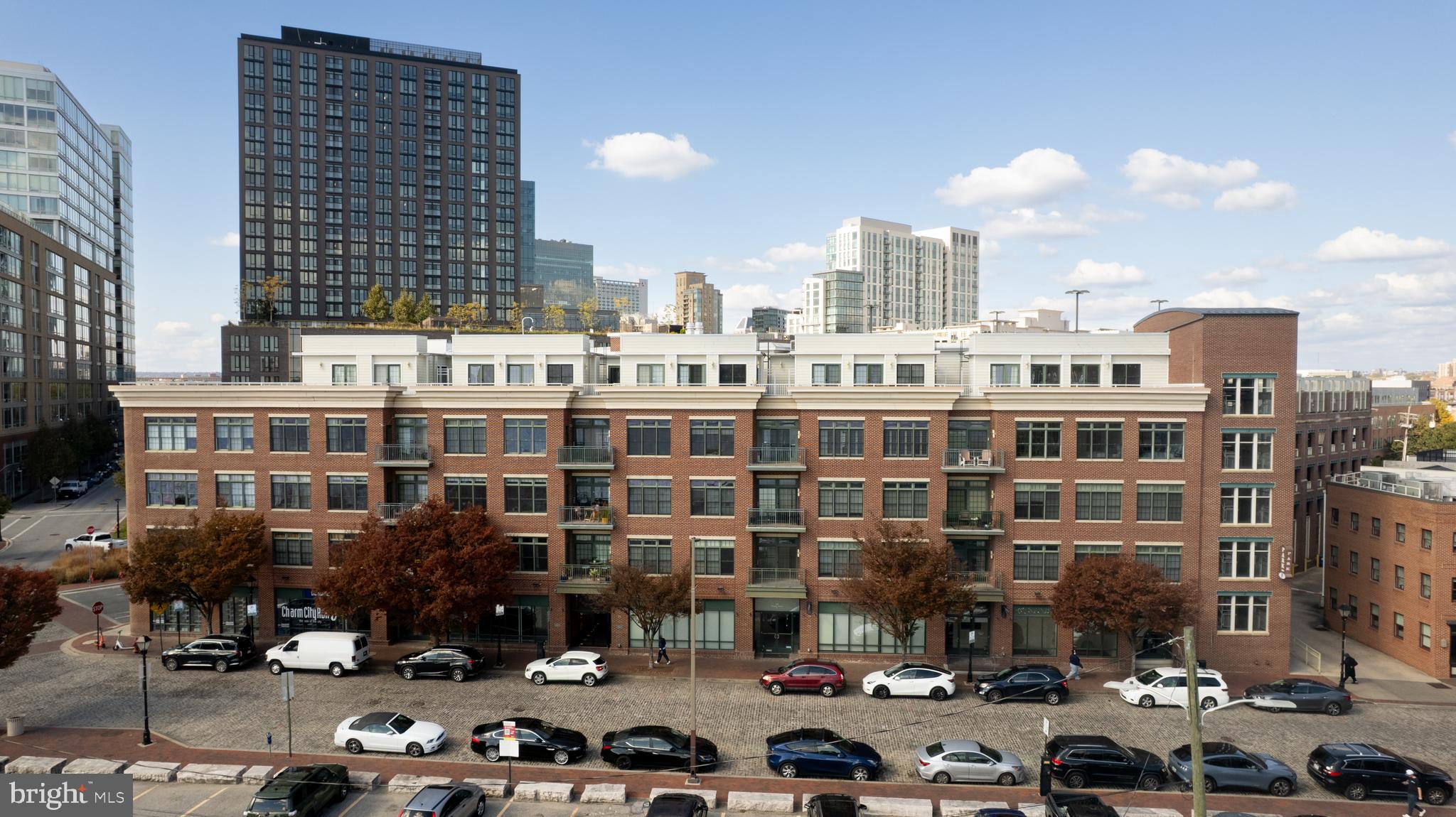 Waterfront Luxury with Private Rooftop Deck in Historic Fells PointExperience waterfront living in the heart of Fells Point at 1500 Thames Street, Unit 401—a rarely available two-level condominium with unobstructed harbor views from nearly every room. Topped with a spectacular private rooftop deck perfect for entertaining, relaxing, or simply taking in sweeping skyline and water views.On the main level, the open kitchen and living room are framed by oversized windows that flood the space with natural light and panoramic harbor vistas. A modern kitchen with white cabinetry, quartz countertops, and stainless appliances opens seamlessly into the living and dining areas—ideal for both everyday living and gatherings. The primary suite offers a walk-in closet and spa-like bath, while the second bedroom doubles beautifully as a guest room or home office. Upstairs, a versatile bonus room flows out to the expansive rooftop deck for the ultimate indoor-outdoor lifestyle.This boutique building offers secure, key-card access, the rare convenience of two indoor garage parking spaces located on the same level as the unit, and available guest parking—making city living both effortless and welcoming.A Day in the LifeImagine waking up to the sun rising over the harbor, just beyond your private rooftop deck. A short stroll brings you to Ceremony Coffee for your morning latte—or Sacre Sucré for a Parisian-inspired pastry. From there, wellness is only steps away: find your flow at Pilates House, push your limits at Resistance Cycle, or restore balance and calm at Sedona House.Afternoons invite you to explore Fells Point’s boutiques—curating new treasures from Su Casa, Brightside Boutique, or Zelda Zen. Browse gourmet blends at The Spice & Tea Exchange, discover coastal-inspired gear at the Fells Point Surf Shop, or dig through vinyls at the iconic Sound Garden. With West Elm nearby in Harbor East, your shopping experience is equal parts convenient and elevated.As evening approaches, dinner is an adventure waiting to happen. Savor neighborhood favorites at the waterfront, or be among the first to experience Josefina—the highly anticipated new Spanish-inspired restaurant opening at Harbor Point, just steps from your door. And when the occasion calls for dining at home, Whole Foods is a short walk away, making entertaining effortless.This is more than a home—it’s a curated lifestyle of ease, luxury, and connection, where every café, studio, and boutique is within reach. From morning coffee to evening cocktails overlooking the skyline, this walkable waterfront lifestyle could be yours.