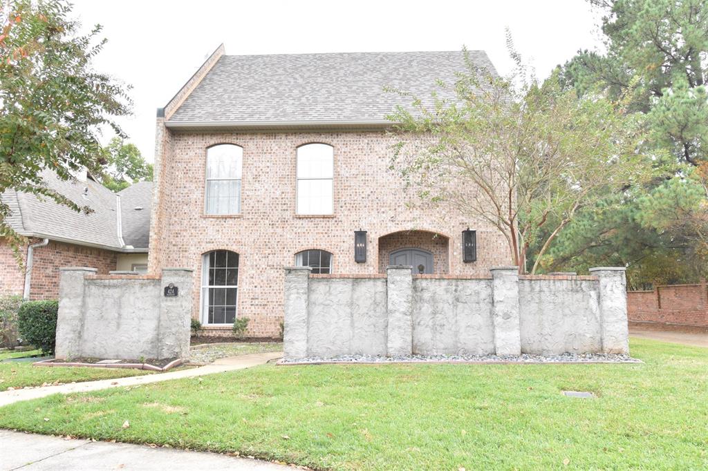 This two-story home offers a French country–inspired facade with classic brick siding and a shingled roof. A fenced front yard welcomes you to the entryway, where a high ceiling, chandelier, arched walkways, and tile flooring create an inviting first impression. The living area features wood-finished floors, recessed lighting, and a glass-covered fireplace that adds warmth and character.

The kitchen is designed with dark countertops, black appliances, white cabinetry, and light tile flooring, flowing seamlessly into the dining area with recessed lighting. Each bedroom includes wood-style flooring and recessed lighting, providing comfortable private spaces throughout the home.

The bathrooms are well appointed with vanities, tile flooring, a jetted tub, and walk-in showers. Combining thoughtful design and functional layout, this property offers both comfort and convenience in a desirable Shreveport location.