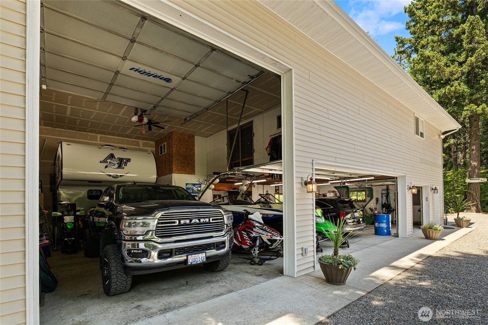 An incredible 4-bay shop featuring a 34-foot RV bay with a 14-foot door—offering exceptional space for your RV, boat, vehicles, recreational gear, and all your mountain toys!