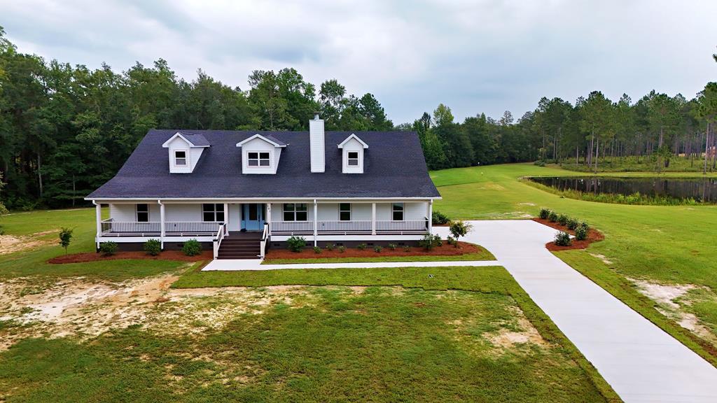 Where southern charm meets modern day elegance! This inviting remodeled home is filled with custom shelving all throughout, hard surface countertops, LVP flooring, and beautiful real wood tongue and grove ceilings and fireplace hearth. 101 Sandy Creek Lane is situated on over a 4-acre lot with pond view and welcomes you into an open floor plan with 3 spacious bedrooms ,2 bathrooms and large office/study could be a 4th bedroom.  Master bathroom has luxury tiled shower and double sinks.  A seamlessly blended living, dining, and kitchen combo with a sliding glass door entry way taking you into an extensive screened in porch. Just minutes away from town this home is perfect for you and can be yours! Call your favorite realtor to make an appointment today!
