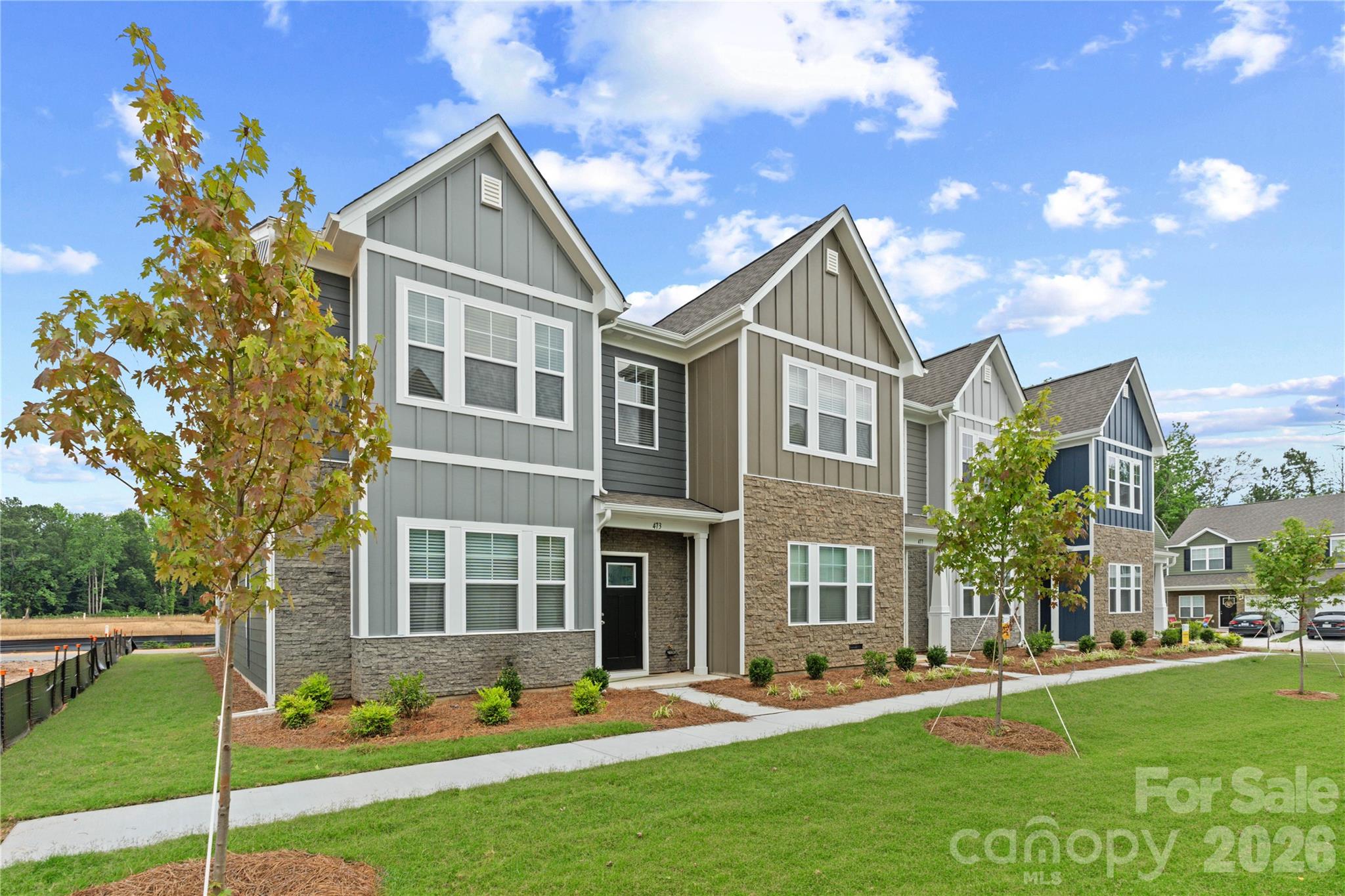 Move-in ready townhome in Sierra Ridge featuring 3 bedrooms, 2.5 bathrooms and a spacious loft. This thoughtfully designed floor plan includes a convenient drop zone off the garage and an open-concept main living area ideal for everyday living and entertaining.The kitchen features 42-inch cabinets, quartz countertops and an oversized breakfast bar overlooking the living area. Upstairs, the owner's suite offers a large walk-in closet and private bath with dual vanities and a walk-in shower. Two additional bedrooms, a full bath and a versatile loft provide flexible space for guests, a home office, or hobbies.For a limited time, eligible buyers may receive up to $15,000 toward closing costs when using a preferred lender. A move-in package including a washer, dryer, refrigerator and window blinds is also available. Buyer to verify eligibility and incentive details.Conveniently located in Gastonia near the FUSE District, downtown dining and entertainment and outdoor recreation at Crowders Mountain State Park. Easy access to I-85, Charlotte Douglas International Airport and Uptown Charlotte provides added convenience for commuting and travel.Incentives, pricing, features, and availability are subject to change without notice. Buyer and buyer's agent to verify all information.