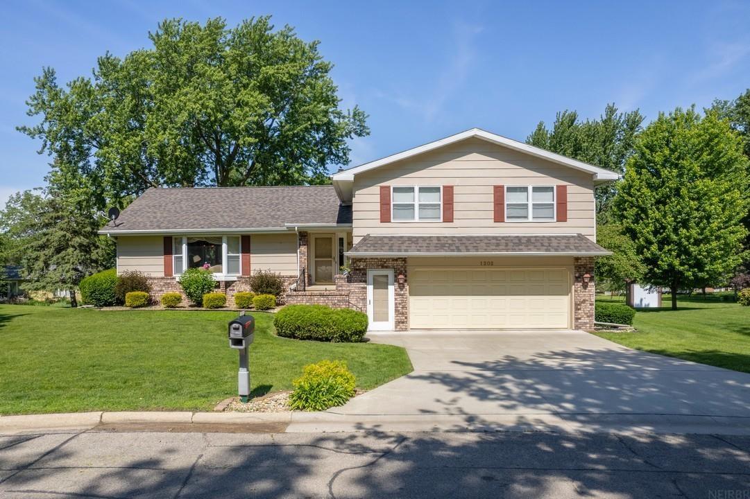 Situated on a beautiful 1/3-acre lot on Ellis Drive, this well-maintained four-level home offers approx. 2,422 sq ft of living space featuring 3 bedrooms, 3 bathrooms, and a functional multi-level floor plan. A foyer welcomes you into the home’s main level, which includes: spacious living room with a bay window, formal dining room with sliding doors leading to the elevated deck and backyard, an open kitchen with quality finishes, and convenient main-floor laundry. Upstairs, the primary suite includes two closets and a private en suite bath. Down the hall are two additional bedrooms and a full hall bath. The lower level has a comfortable family room with a wood stove and walkout access to the backyard, plus a half bath. The basement level provides ample storage and utility space, along with an additional ¾ bath. Completing the property is a 2-car tuck-under garage. This rare one-owner home in a highly desirable location is ready for you!