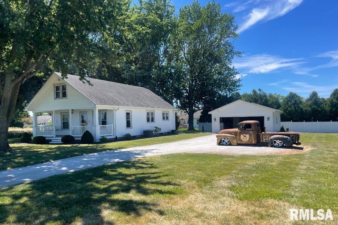 Charming bungalow on a spacious 2/3-acre lot offering the perfect blend of character and modern updates. Inside, you’ll find warm woodwork, hardwood floors, and an inviting layout featuring a bright living area, updated kitchen with granite countertops and island seating, and stylish dining space. The upper level provides additional flexible living space and storage. Step outside to enjoy the oversized 2-car garage, expansive yard, and unique gazebo area—perfect for relaxing or entertaining. With timeless charm, thoughtful updates, and room to spread out, this property offers comfort, functionality, and tranquility just blocks from the center of town.  The second room on the main floor is currently being used as an office can be used as a bedroom.