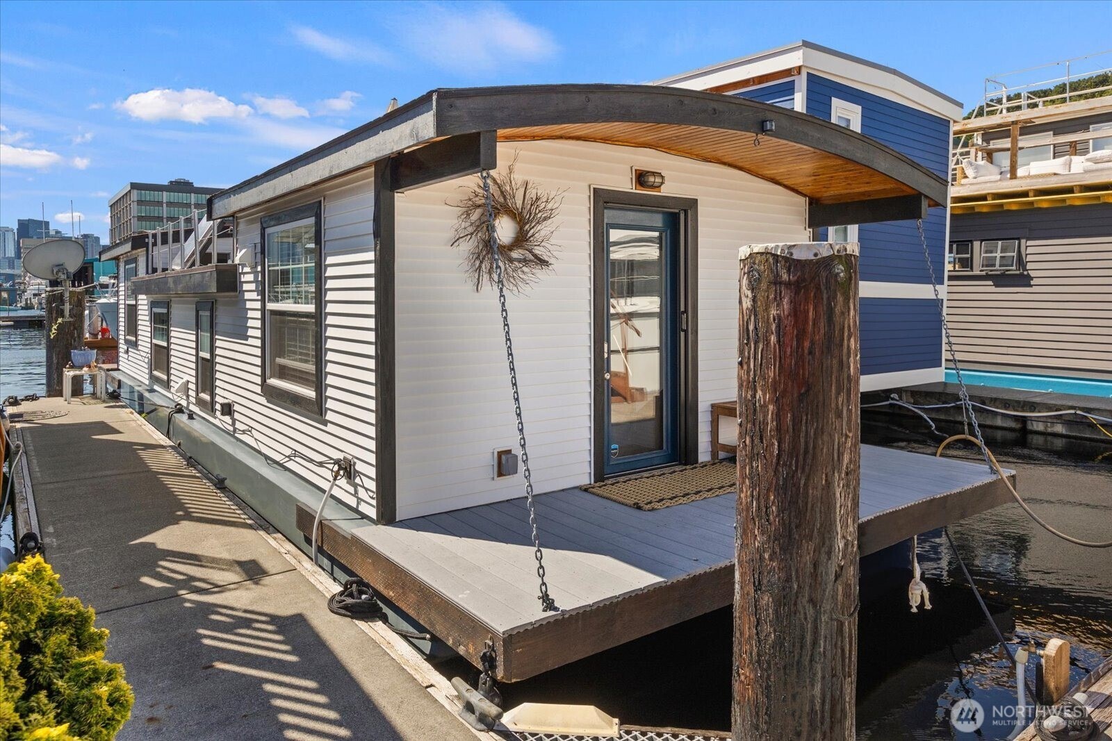 Welcome to Swan Song, a 2br City-registered liveaboard houseboat w/ great views from the center of Lake Union! High ceilings, newer windows, 14'+ beam w/ parquet floors & loads of natural light. Enter to 9.5' coved fir ceilings, lg bedroom w/ dual closets & clerestory windows for extra ambiance. Down the wainscoatted hallway to 2nd bed/deluxe home office! Dine-in kitchen w/ full-sized appliances, marmoleum floors, skylight & W/D hookups. Living w/ parquet floors, higher coved fir ceiling & bright light. Large, freshly-refinished roof deck boasts views of Gasworks, Downtown, Space Needle & an expansive water view of all the happening activities on the Lake. On the BG Trail w/ off-street parking & easy public transit right outside. FOWR 818.