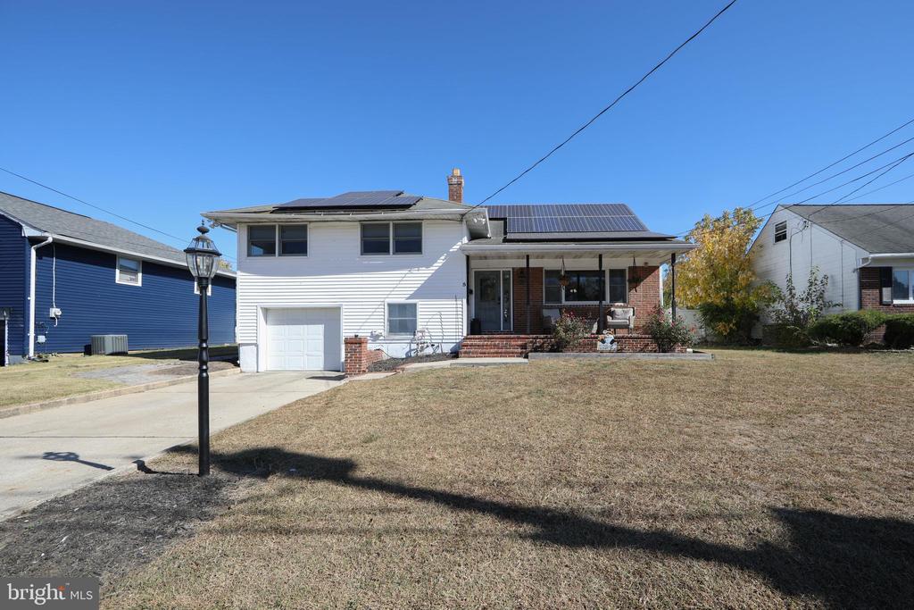 JUST IN TIME FOR SPRING! Welcome home to this gorgeous split level home, tucked away just minutes from the river! Upon arrival you are greeted by a spacious front yard and a large covered front porch. Entering into the home you'll find a slate tile floor foyer that opens up to hardwood flooring that expands throughout the main level. The living room offers a bright and spacious feel with an open floor plan that allows the kitchen and dining room into the space. The kitchen was recently updated (2025) with new white cabinetry, stone countertops and a tiled backsplash. Off the dining room is the family room with a brick wood burning fireplace as a focal point and large windows overlooking the backyard. Upstairs you'll find an updated full bathroom with double vanity and a shower/tub combo with tiled surround. On this level, you'll also find the spacious primary bedroom and two additional bedrooms, as well as access to the walk up attic. This space is great for additional storage, and could potentially be finished to add more living space to the home. The lower floor offers access to the one car garage, the laundry room and the fourth bedroom with attached full bathroom that offers a tiled shower with rainfall shower head and built in seat. Out back you'll find an ample sized, fully fenced, rear yard that boasts a concrete inground pool, beautiful paver patio and gazebo. This home is also conveniently located in a prime location for commuters with being just a short drive to major roadways like Route 130, 295 and the NJ turnpike. Don't miss your chance to see this home today, it won't last long! Property is being conveyed in as-is condition, buyer is responsible for any lender and township requirements. Sale is contingent on suitable housing for the Seller.