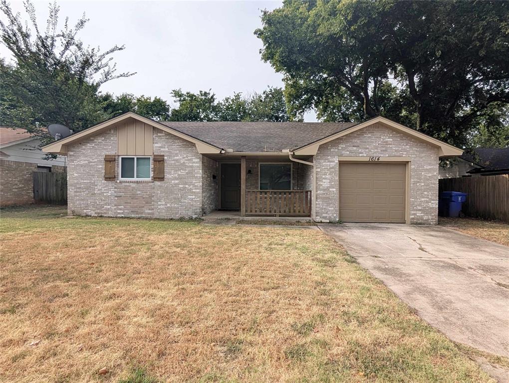 This charming brick home offers a comfortable layout with spacious living areas and plenty of natural light throughout. The kitchen features abundant white cabinetry, generous counter space, tile flooring, a tile backsplash, and an adjoining dining area with sliding glass doors leading to the backyard. The bedrooms offer comfortable space and ample closet storage, while ceiling fans throughout add everyday convenience. Outside, enjoy a large fully fenced backyard with a patio and mature trees, providing plenty of room for outdoor activities. A covered front porch and attached one-car garage complete this inviting home. Conveniently located near shopping, dining, schools, and everyday amenities. Schedule your showing today!
