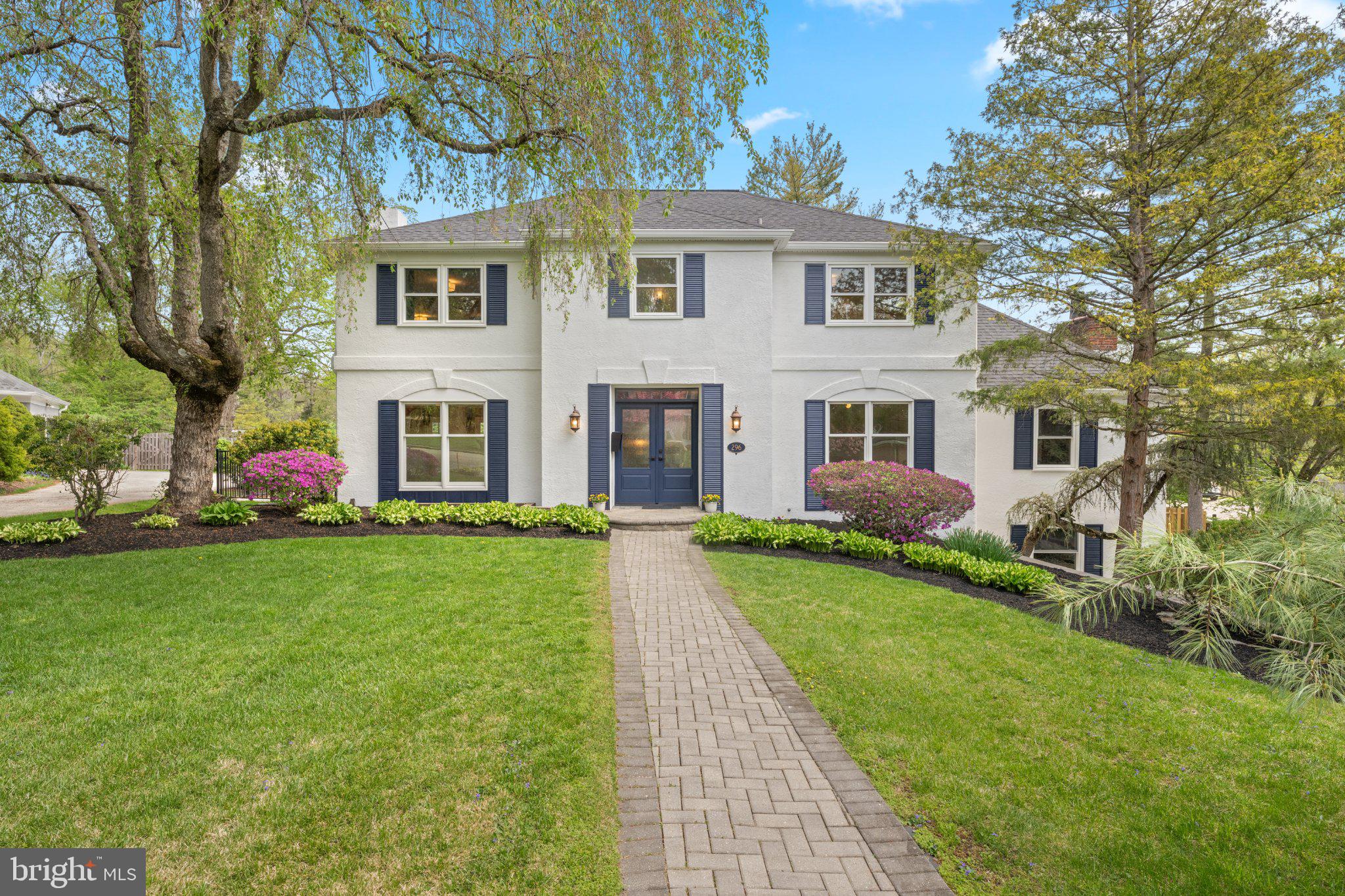 Located on a quiet, U-shaped street with immediate access to the Indian Creek walking trail, this Elegant French Colonial offers an ideal balance of neighborhood connection and private serenity. The residence boasts outstanding curb appeal, framed by perfectly curated landscaping with multiple specimen plantings. Newer double front doors (2021) open into a bright foyer where a striking open-concept staircase and custom millwork throughout establish an immediate sense of quality.The home’s architectural design and thoughtful decorator choices—including arched doorways, neutral grasscloth and ethereal silk wallcoverings, serene paint colors,—create a peaceful, harmonious environment. This tranquil interior serves as the perfect backdrop to connect with nature via expansive windows that frame the surrounding greenery.To the left, the front-to-back living room features custom built-ins that effortlessly function as a butler’s pantry—ideal for hosting—with large, fixed windows overlooking the recently renovated pool. To the right, the spacious dining room serves as a refined venue for formal gatherings.The true heart of the home is the designer eat-in kitchen. Upon entering, you are instantly captivated by a wall of oversized windows that drench the kitchen and breakfast room in radiant light. This gourmet space is appointed with solid wood cabinets, quartz countertops, and a premium appliance package. Exquisite custom millwork is integrated into the surrounding built-ins, designed to marry form and function by providing additional storage solutions without compromising the room’s clean lines.From the kitchen sink, enjoy spectacular views of the rear yard and the lush natural habitat of Indian Creek. Just off the breakfast area, a concealed door reveals an oversized laundry room equipped with a utility sink and a fold-down folding table. This level is completed by a front-to-back family room featuring a vaulted ceiling and sliding doors that showcase the views to the outdoors.The second floor hosts a primary suite designed as a cozy retreat, complete with custom built-ins, a walk-in closet, and a large-footprint bathroom with a double vanity. Three additional well-sized bedrooms share a modern hall bath featuring a curbless shower with a frameless glass enclosure. For additional living space, the lower level is fully finished and recently waterproofed (2025), making it a perfect spot for a home office or recreation room.With major systems recently updated—including the roof (2024), HVAC (2018), many windows (2025), and a replastered pool with new coping (2026)—and located just an easy stroll from Penn Wynne Park and Penn Wynne Elementary, this home is a rare, turn-key opportunity in a stellar location.