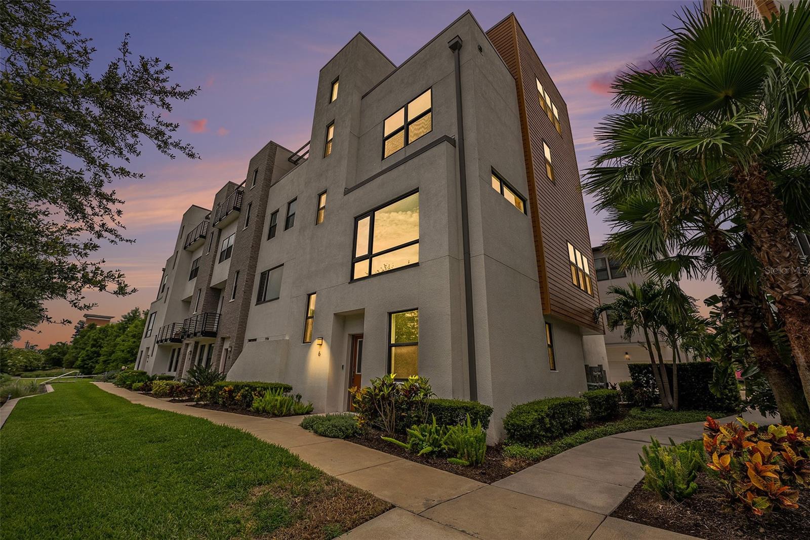 One or more photo(s) has been virtually staged. Exciting opportunity in Westshore Village! This rare and exceptional NO FLOOD ZONE property offers the ultimate in modern urban living. The spacious “SOHO” corner model is a four-story, full concrete block construction townhome with 3 bedrooms, 3 full baths, 2 half baths, and a bonus flex room on the top floor. Enjoy a thoughtfully designed open floor plan with soaring ceilings, engineered wood flooring, and an upscale kitchen featuring a natural gas stove, generous counter space, and modern finishes. Built for peace of mind and energy efficiency, this home features hurricane-impact windows and doors throughout. Additional features include a tankless water heater, a two-car garage, and engineered wood flooring on the stairs and main living area. For added convenience, the unit is prepped for an elevator (pre-wired with rails installed), with the current shaft offering additional closet space on each level. From your private fourth-floor balcony, enjoy unobstructed city views—perfect for relaxing or entertaining. Walk to International Plaza and Bay Street (0.5 miles), Raymond James Stadium (1.2 miles), and neighborhood favorites like Miller’s Ale House and Brick House Tavern—all within a 10-minute walk. Just 3 miles from Tampa International Airport, with an easy commute to Downtown Tampa and St. Petersburg. The Westshore Village community offers top-tier amenities, including a heated Miami-style pool with cabanas, outdoor kitchen, fire pit, and private dog park—ideal for entertaining or unwinding in style. Don't miss this rare opportunity to own a high-quality, low-maintenance home in one of Tampa’s most walkable and vibrant neighborhoods. Schedule your private tour today!