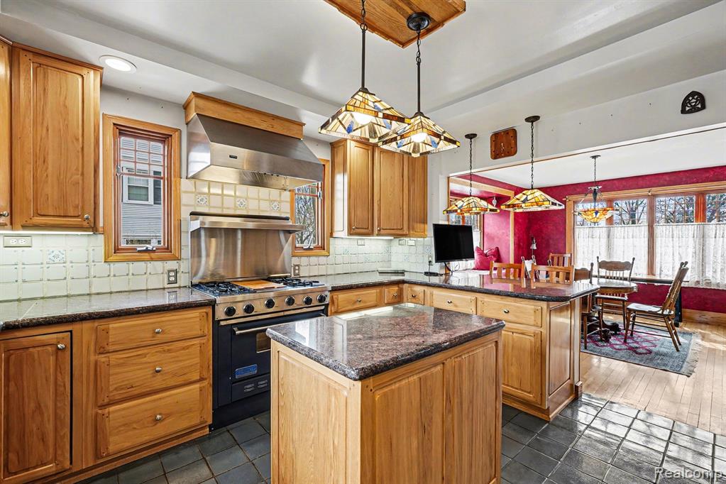 **PRICE Adjustment** Exceptional opportunity in Birmingham, just moments from Downtown Birmingham and walkable to parks, restaurants, and premier shopping. This beautifully maintained home offers approximately 3,300 square feet of refined living space, blending timeless character with extensive, high-quality upgrades throughout.The main level features an open, elegant flow designed for both everyday living and upscale entertaining, with rich hardwood flooring, a wood-burning fireplace with insert, and a chef’s kitchen showcasing custom hickory cabinetry, granite countertops, and a Viking range. Multiple living areas provide comfort and versatility with seamless access to inviting outdoor spaces.The primary suite offers a private, elevated retreat with heated floors, a spa-like bath, and cedar-lined closets. Upper levels include well-appointed spaces with updated finishes, a charming balcony, and flexible living areas ideal for today’s lifestyle. The lower level is a true standout, featuring a custom temperature-controlled wine room and a dedicated game room and playroom designed for all ages, perfect for entertaining and everyday enjoyment. Extensive capital improvements include high-efficiency mechanicals, tankless water heater, whole-house generator, and enhanced insulation, along with a rare heated and cooled garage with workshop capability and finished loft. A must-see home offering location, design, and condition at a level rarely available, this one will not last.
