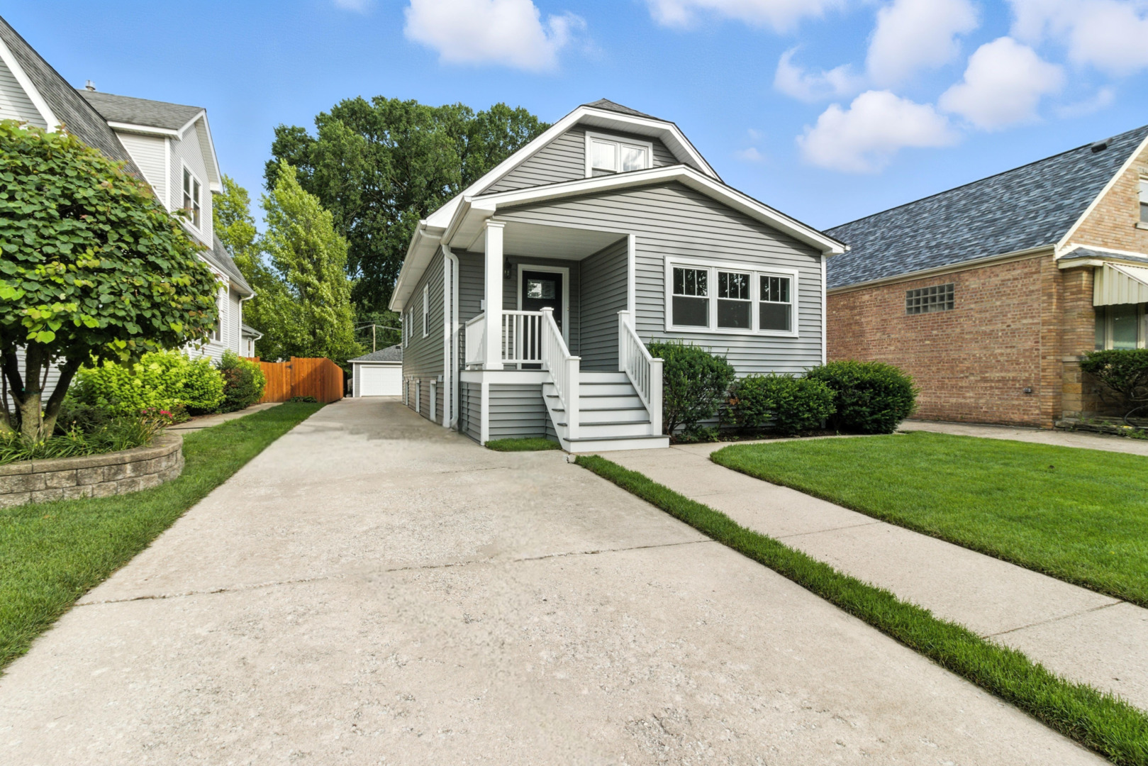 Welcome to this beautifully renovated 4 bed 2.1 bath two-story bungalow, perfectly located in the heart of Norwood Park on an oversized city lot with a side apron driveway and spacious garage. From the moment you enter, you'll be impressed by the warmth of the hardwood floors that flow throughout the spacious main level. At the entry, a sunlit front room with desirable western exposure offers the perfect space for a home office, reading nook, or cozy sunroom. This home features a generous living room and a stunning eat-in kitchen. Outfitted with stainless steel appliances, sleek quartz countertops, and ample cabinetry, the kitchen is designed to impress-ideal for entertaining and everyday living. The main floor offers two well-sized bedrooms and a full bath, while the second level provides two additional bedrooms and another full bathroom-perfect for growing families or guests. Additionally, the fully finished basement offers a spacious family room, perfect for extra entertainment or relaxation. Step outside and enjoy a beautifully manicured yard with plenty of space to relax, play, or garden-perfect for enjoying all four seasons. Located within walking distance to expressways, restaurants, nightlife, parks, and shopping, this home combines charm, comfort, and convenience. Move-in ready and waiting for your personal touch, this is truly a must-see property. Don't miss out-this gem won't last long, bring in your offers.