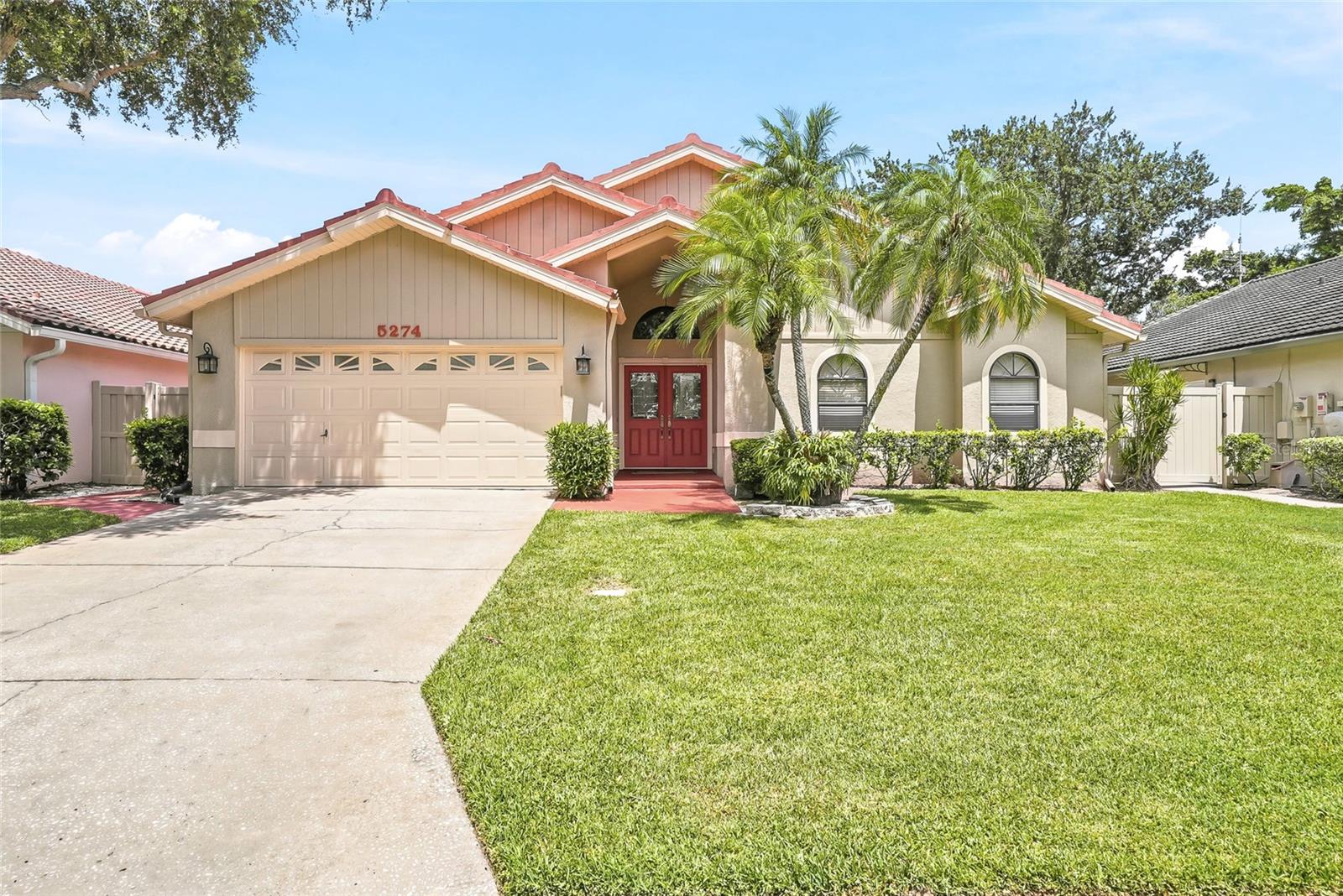 An exquisitely updated residence within the gated community of Placido Bayou. Where soaring ceilings, abundant natural light, and thoughtfully designed living spaces create an extraordinary appeal of openness and sense of extra living square footage. Every room feels bright, airy, and inviting, creating an atmosphere that is both elegant and comfortable. Furthermore, the gorgeous wood-plank tile graces all floors within the home providing a clean and continuous foundation for your aesthetics.At the heart of the home is a completely open-concept kitchen, living room, and dinette that seamlessly connect for everyday living and entertaining. The kitchen is truly magazine-worthy—a stunning showpiece that could easily grace the pages of a luxury home publication. Featuring custom cabinetry, a designer range hood, stainless steel appliances, an oversized breakfast bar island with additional storage and custom accent lighting fixtures, every detail has been thoughtfully curated. The exceptional quartzite countertops elevate the space with timeless beauty and sophistication while providing abundant room for meal preparation, casual dining, and entertaining.The dramatic living room is anchored by a chic wood-burning fireplace framed by elegant French doors. Open them wide to embrace true indoor-outdoor living as the interior extends effortlessly to the expansive screened lanai and sparkling pool and yard beyond.Designed with a highly desirable split-bedroom floorplan, the spacious primary suite offers a private retreat with serene views of the pool and backyard via its private French doors. The stunning, renovated bathroom showcases custom cabinetry, designer lighting, beautiful tilework, and a luxurious spa-inspired shower.Outside, the backyard offers something for everyone—sun-drenched lounging areas, a shaded entertainment space, and an expansive lawn perfect for play, pets, or future outdoor enhancements. The screened lanai and covered patio provide year-round enjoyment of Florida's beautiful weather.Additional highlights include a spacious two-car garage (which has vents for cooling if the buyer wishes), abundant storage and a utility sink.With exceptional proximity to downtown St. Petersburg, dining, shopping, entertainment and golfing and 25 minutes to two international airports and sandy beaches, this neighborhood has it all!