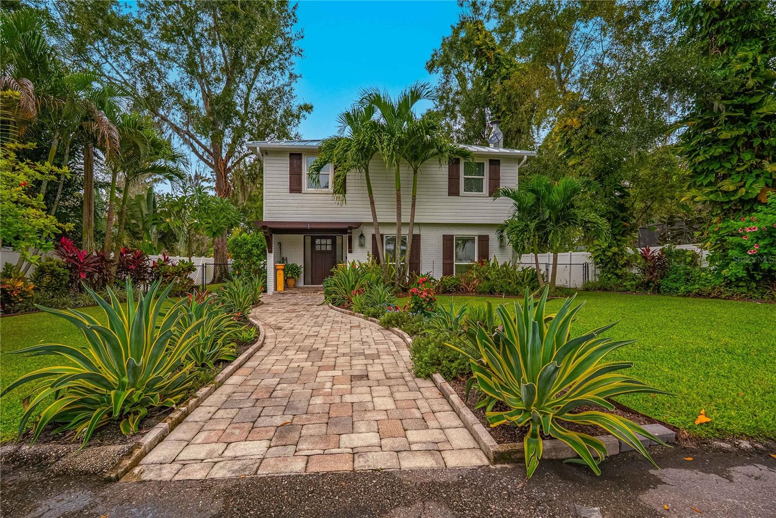 Magnificent waterfront 2-story four bedroom 2 1/2 bath pool home with private gate and over 3/4 of an acre!! This property is immaculate inside and out. Ample storage throughout the grounds for all of your outdoor and water sports toys. There's even a covered boat lift with large dock, ready for all of your river, boating experiences. Pristine landscaping lead you into the front entrance where you're greeted by a gorgeous, formal foyer, high ceilings, and gleaming floors! The formal living room faces the front of the property while the formal dining room Eden kitchen faces the back yard with screened in pool; excellent for lounging or entertaining. The spectacular kitchen features tons of cabinet and counter space perfect for cooking this delicious meals as well as a breakfast bar and a wine fridge. The downstairs half bath is conveniently located in the middle of the floor plan, conveniently located off of the laundry room, which also features a tremendous amount of space and extra storage. Upstairs features spacious bedrooms and gorgeous main bathroom with dual sinks, huge vanity and an oversized shower. The master suite has sliding glass doors onto a balcony which overlooks the backyard, pool area, and beautiful riverfront!! Truly, an oasis to behold. Don't miss this opportunity… Call now to schedule your showing and make it your home today.