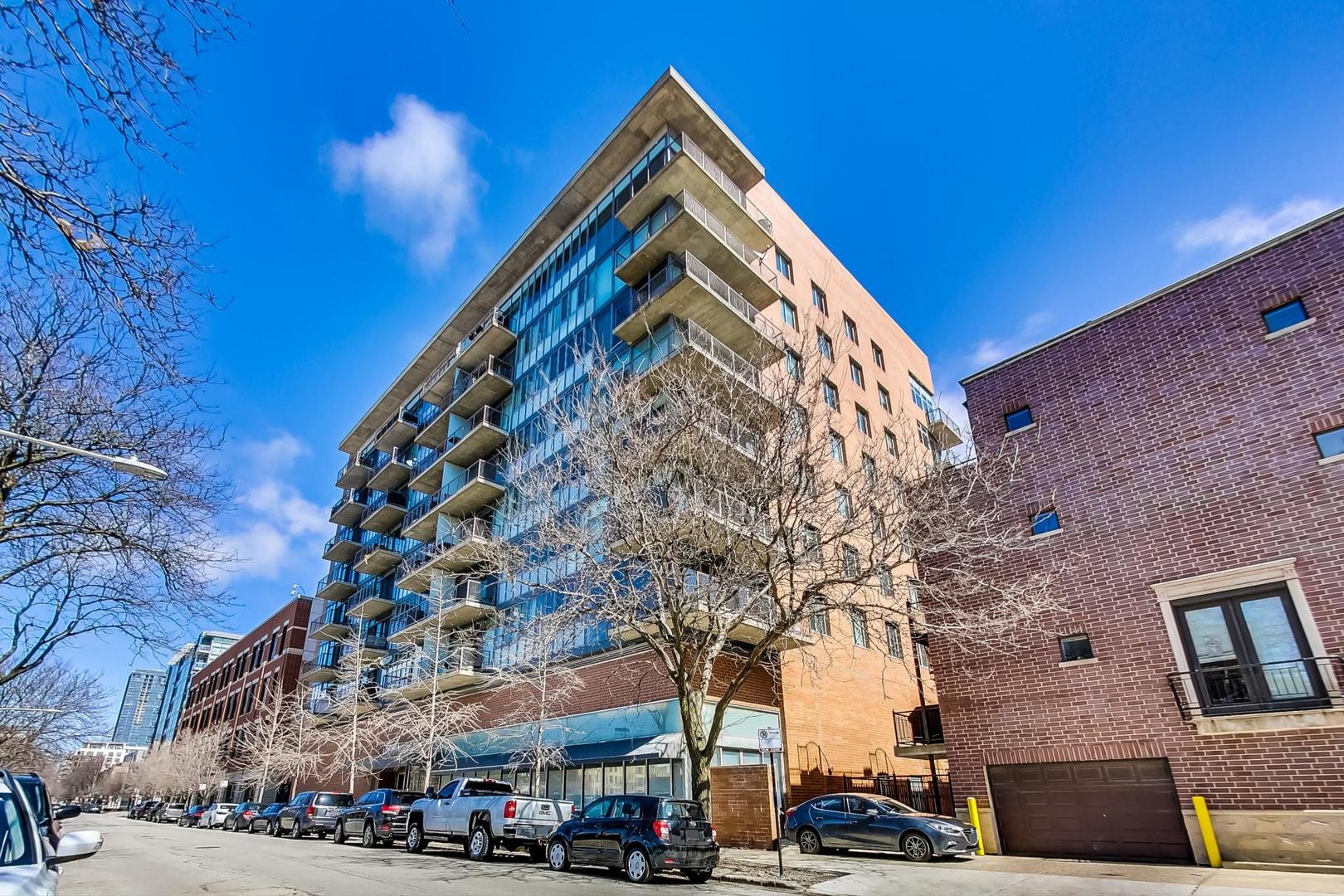 This stunning 2-bedroom, 2-bathroom corner condo in the vibrant West Loop neighborhood of Chicago offers both style and comfort. Boasting an expansive wrap-around balcony, the unit provides breathtaking city views and ample outdoor space for relaxation or entertaining. Inside, the open-concept living area features floor-to-ceiling windows, allowing natural light to flood the space, complemented by modern finishes and high-end appliances. The gourmet kitchen is perfect for culinary enthusiasts, equipped with sleek cabinetry and a spacious island for casual dining.  Both bedrooms offer generous space, with the primary suite featuring an en-suite bathroom for added privacy and roll-in shower. Conveniently, the condo includes a deeded garage parking space, making city living even more accessible. With its prime location, this condo is an exceptional find in one of Chicago's most desirable neighborhoods.