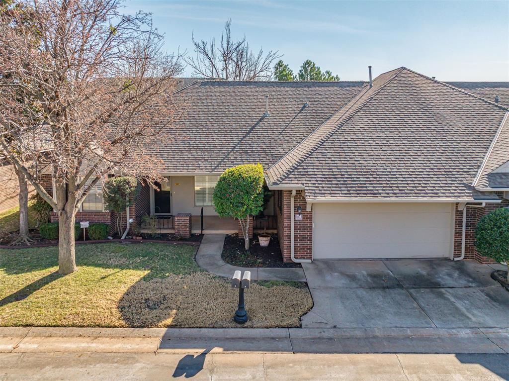 Saint Andrews Condos--where the living is easy--and this home is BEAUTIFUL with many upgraded features and much architectural interest! This 2 BR, 2 Bath, plus office/flex room/3rd bedroom home is large and spacious and offers new granite countertops, updated shower, solid surface flooring, new protective gutter shields, marble windowsills, plantation shutters, 12-foot ceilings, extensive crown molding, and more.  MIL floor plan with both bedrooms offering walk-in closets and full baths.  Enjoy coffee on the covered front porch or in your back patio garden.  Ready for a laid-back lifestyle where the HOA takes care of the gated entrance, insurance coverage of the exterior, mowing, approved landscaping, sprinkler system, street maintenance, and exterior painting?  Ready for a partially furnished home?  Seller is willing to leave living room and breakfast nook furniture and artwork, washer and dryer, and 2 refrigerators with an acceptable offer.  The location is superb with quick access to Hefner Parkway, the Kilpatrick Turnpike/Memorial, Mercy Hospital, the Greens Country Club, and too many shopping and restaurant locations to list!  The Saint Andrews Condos-one of the best kept secrets in NW OKC.