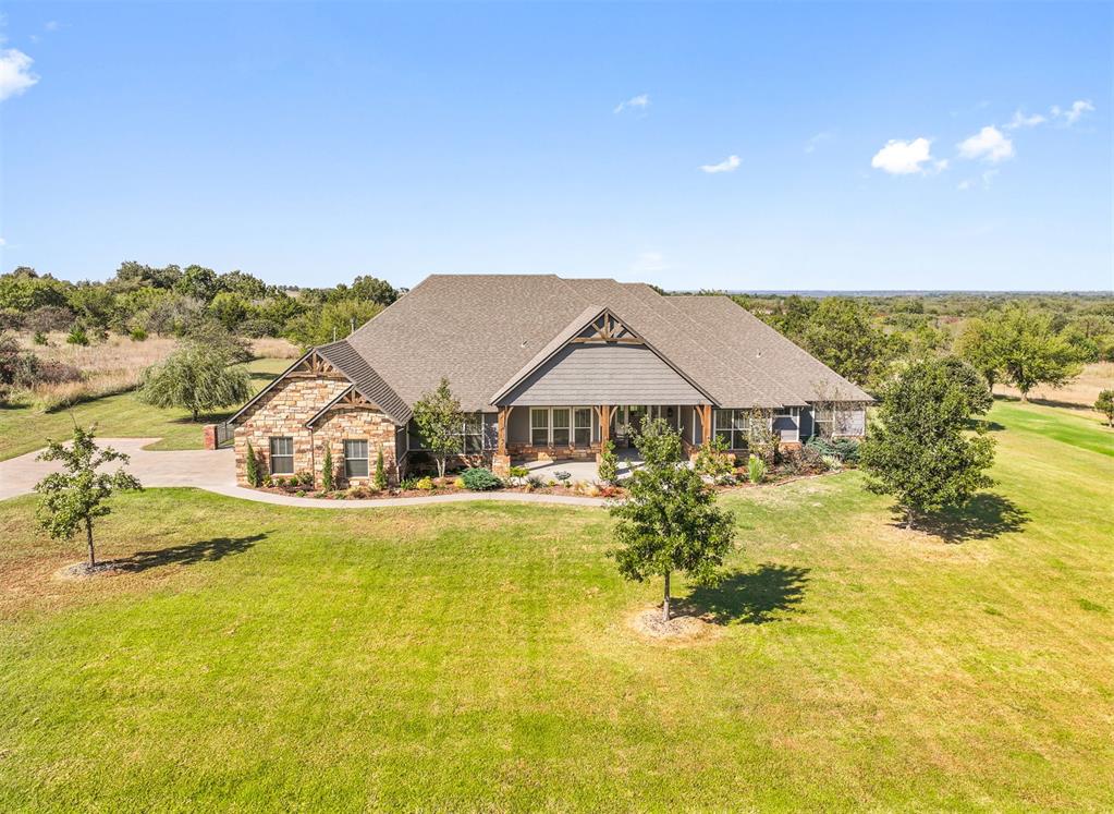 New Listing in Manor Lake Hills, a highly sought after gated community!

Set on three acres, this custom built home was designed for both quiet mornings and lively gatherings. 

Inside, you’ll find a bright open floor plan framed by beamed ceilings, floor to ceiling windows, and a stone fireplace that brings the whole space together. The chef’s kitchen, features a massive island, custom vent hood, and granite counters, with a built in coffee bar for your morning ritual. A dedicated study and flex room provide space for work or play, while a safe room adds peace of mind. The primary suite is a retreat of its own, complete with a soaking tub, walk-in shower, and a generous walk-in closet. Step outside to your own personal outdoor sanctuary, a covered patio with a built-in grill, stone fireplace, and mounted tv, perfect for game days and evening gatherings under the Oklahoma sky.

Manor Lake Hills boasts exclusive amenities, including a scenic walking trail, a stocked fishing pond, and a community pool with a clubhouse.

Located just 8 miles from OU and 30 min drive to Will Roger Airport, this property offers a perfect balance of privacy and convenience.