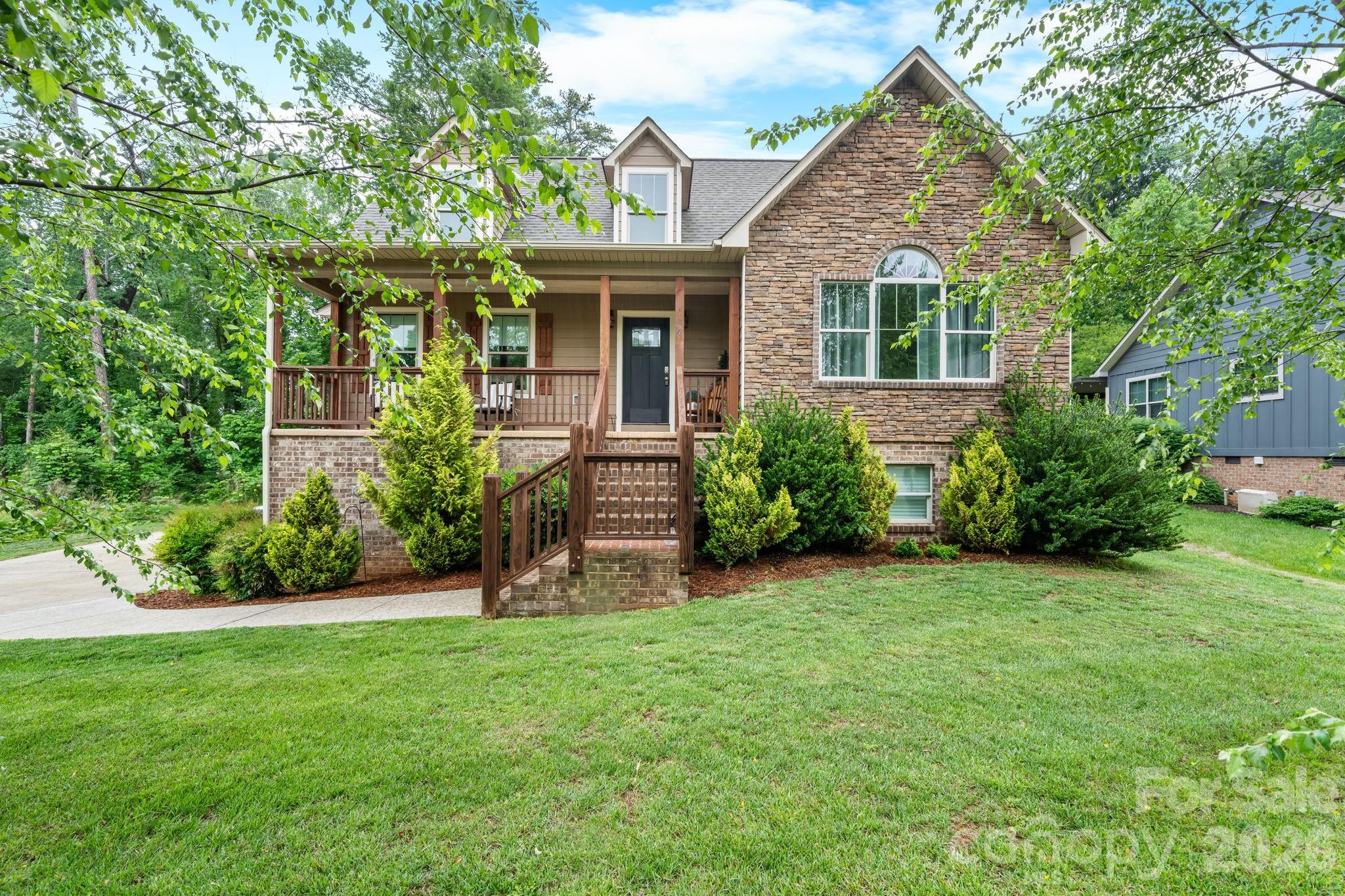 Gorgeous one-and-a-half story Craftsman-style home featuring 3 bedrooms and 2.5 baths in the sought-after Maplewood Village subdivision of Hudson. The main level offers a spacious open floor plan with towering cathedral ceilings, a cozy gas log fireplace, and abundant natural light throughout the living area. The dining area features a charming corner built-in, perfect for displaying your favorite china or providing additional storage.The kitchen is truly a dream for any cook, complete with custom alder pine and oak cabinetry, granite countertops, an island, breakfast area, and stainless steel appliances.The primary suite is located on the main floor and features soaring cathedral ceilings, beautiful natural light, and a spacious walk-in closet. The luxurious primary bath includes granite countertops, double vanities, a soaking tub, and a gorgeous tiled shower. A convenient half bath and laundry room complete the main level. Upstairs, you’ll find two well-appointed bedrooms connected by a full bath with double vanities. One of the secondary bedrooms also includes a separate small bonus room — ideal for a home office, nursery, reading nook, gaming area, additional closet space or hobby room. The unfinished basement offers endless possibilities for future expansion, storage, workshop space, or recreation areas. Covered front porch and back deck. In this coveted subdivision, residents enjoy wonderful neighborhood amenities including desirable schools, sidewalks, walking trails, a playground, and a picnic shelter — making this one of the area’s favorite communities.