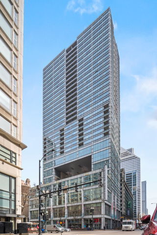 Rarely available high-floor Southeast corner residences with   breathtaking, designer-updated in the iconic Joffrey Tower! Soaring floor-to-ceiling windows frame sweeping views of Lake Michigan, Millennium Park, and Chicago's dazzling skyline. This sophisticated home shines with recent upgrades, including wide-plank hardwood floors, electric blinds, custom lighting, and fresh designer paint throughout. The chef's kitchen is a showstopper, featuring rich custom ebony cabinetry, quartz countertops with a dramatic waterfall edge, full-height backsplash, Grohe faucet, and premium KitchenAid stainless steel appliances. Wake up to sunrise views over Lake Michigan from your spacious east-facing primary suite, complete with a large walk-in closet and a spa-inspired bath boasting dual vanities, natural stone finishes, and a deep soaking tub. Large second bedroom. Beautifully updated second bath. Step onto your expansive south-facing terrace and take in panoramic views. Joffrey Tower offers full-service luxury living with 24-hour door staff, one of the city's premier fitness centers, on-site management, dry cleaning, and additional storage. Prime garage parking included.