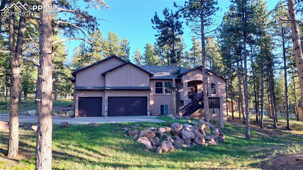 Brand new (April 2026) Class 4 impact-resistant shingle roof installed offering durability, peace of mind, and potential insurance savings, backed by a 15-year guarantee. Tucked away at the end of a quiet cul-de-sac, this 7-bed, 3 1/2 bath home offers more then 5,200 sq ft of flexible living space on nearly an acre of wooded land. Designed for both comfort and entertaining, it blends Colorado mountain living with modern convenience. Inside, soaring 10-foot ceilings and oversized windows flood the main floor with natural light. The living room centers around a cozy gas fireplace, while the open dining area and spacious kitchen make hosting easy. A large primary suite featuring a sitting area, 5-piece bathroom with clawfoot tub and walk-in shower. With seven bedrooms, this home adapts to your lifestyle - whether you need guest space, home offices or a separate in-law suite with walk-out access and kitchenette potential. The basement rec room is perfect for game nights, fitness or hobbies. Step outside to your deck surrounded by trees - idea for summer BBQ's, morning coffee, or simply soaking in the peace of Woodland Park. The 3-car garage and flat driveway add daily convenience. Located minutes from schools, shops and dining, yet surrounded by nature trials and mountain views, 1020 Parkway Lane combines privacy, space and location in one rare package.