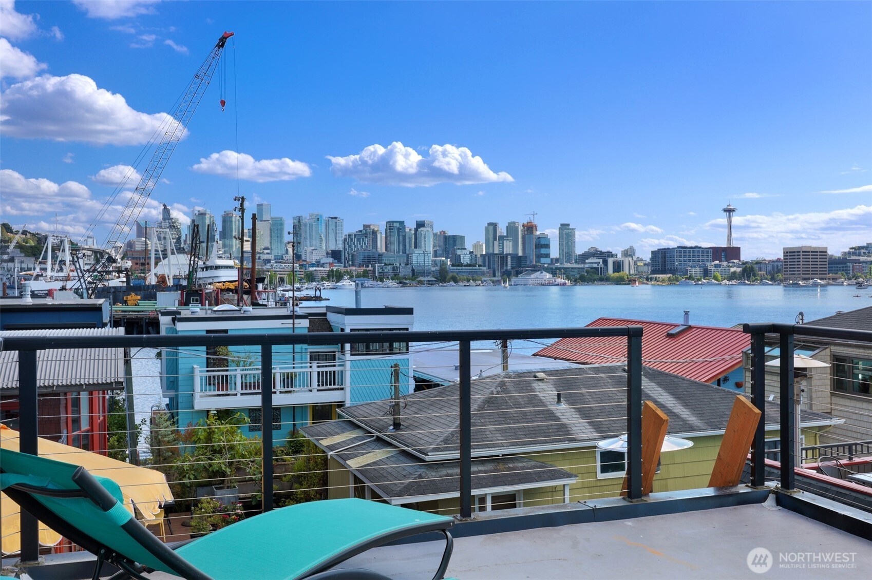 Come aboard this cheerful 2 bedroom, one bath floating cottage on an active co-op community with owned moorage plus room for your boat.  The setting is peaceful and the sun is soothing as it covers 3 separate outdoor options.  Enjoy the water connection on the first floor covered deck.  Or maybe you want to enjoy the majestic city views and admire a brilliant Space Needle view from your primary bedroom balcony (that’s our favorite spot!).  Finally, the rooftop ~ a perfect blend of light, 360 views, and entertaining.  A recent beautifully remodeled kitchen is perfect to gather around the large island.  Super versatile mud room/laundry room/pantry to keep things tidy.  Hardwood floors lead you to a cozy living room and in true cottage style a set of french doors to the south deck.  Plenty of storage tucked conveniently throughout the home whether  in bedrooms, under the stairs, or in the attic. Speaking of storage, store those kayaks and paddle boards on either side of your wrap around deck.  Here’s to new beginnings! This home is complete with a home inspection and dive report.