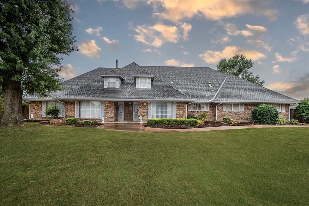 3120 Kent Drive is a 7000 square foot Custom Built Home in a coveted location! Burke Northridge Manor. You are invited into the grand foyer to a 40x37 Living Area with a Wood Burning fireplace, Custom and exquisite Wood Panel Walls. Joined by a 14X40 Sunroom with 2 Sky lights, its own Heat and Air system.  Glass Wall with view of a beautiful Landscaped Yard. A Bar Off of the Grand Living Area. Downstairs Main Suite Offers Living Area, Full Bath with separate Vanity.  2 Large Closets with Custom Designed Built-in Cabinets and Storage. Make up Vanity and Separate Dual Sinks Vanity. Must see Virtual Tour Photos. Second Bed Downstairs with a Full Private Bath. This Home affords 2 Bedrooms, upstairs and a Flex Room. One Bedroom Can Fit 3 Queen Beds.  Large Upstairs Bonus Room with a Wet Bar, Bring Your Pool Table. Flex Room up also. Large Attic Space and Covered Floor.  One Stair Well from Main Entry and from the Bonus Room leading to Kitchen. Large Kitchen Island with Cook Top and Fan Hood, 2 Wall Ovens and Microwave. Built In Desk for the Chef. Large Eat in Kitchen area. Downstairs Flex, Office or Hobby Room off Kitchen. Outside view from the Covered Patio Overlooks Hammock Swing under a shaded tree, Fenced in Garden with raised beds. This Spacious Landscaped Yard Also Offers a Heated Workshop and farther back in yard a shed for Lawn Equipment. Fenced Entry to 3 Car Garage with sink and door to back Yard. Private Parking for 6 plus cars. Home has 4 Heating and Air units, Heated Garage. View of Lake Hefner from the Street. Must See Photos and Virtual Tour to appreciate more of what this Family Home offers. WELCOME HOME!