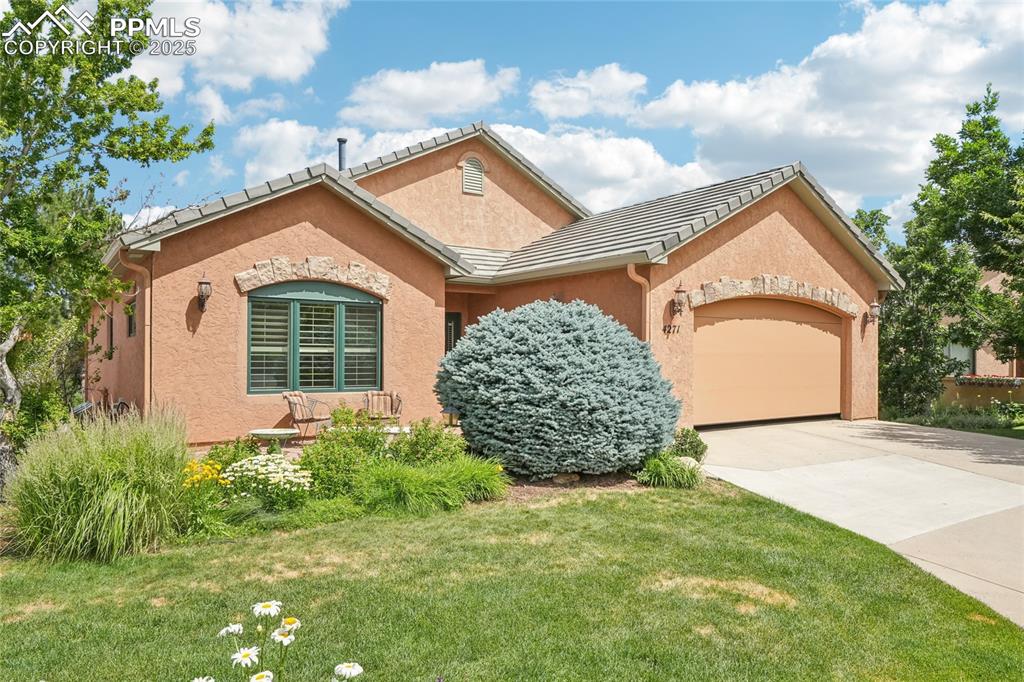 Come experience this luxurious residence nestled in the highly sought-after southwest Colorado Springs neighborhood of Star Ranch. This home combines elegance, comfort, and stunning mountain-adjacent scenery, offering the perfect retreat for buyers seeking both style and substance. With more than 3,000 square feet of living space, this well-maintained property features large living areas, bright interiors, and seamless flow from the foyer to the main living and dining spaces. The chef's kitchen features ample upscale cabinets, sleek countertops, and stainless steel appliances. The flowing layout makes this space ideal for entertaining. Also on the main level is a generous office space, and an elegant primary suite – complete with his and hers bathrooms, one with a large tiled shower and one with a walk-in bathtub. Downstairs is a generous family room and two well-appointed secondary bedrooms and full bath, ensuring comfort and convenience for guests or family, plus several bonus spaces. Outdoor maintenance is handled by the HOA, so that you can enjoy the best life has to offer without being saddled with yardwork.