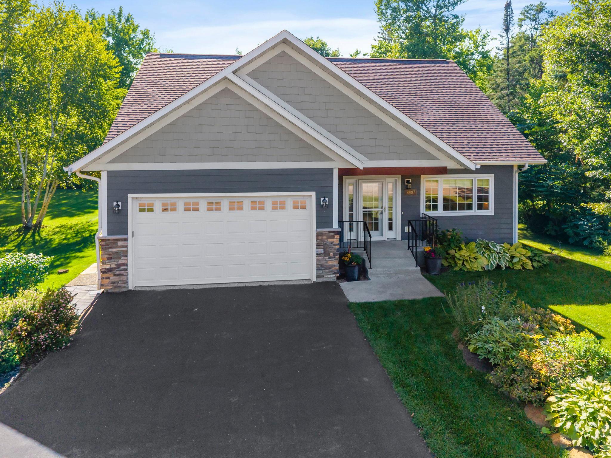 Welcome to this 5 bedroom, 3 bathroom home in Kabekona Village with access to Kabekona Bay/Leech Lake in Walker, offering the peaceful, wooded privacy, just minutes from town. The neighborhood includes deeded lake access, a private beach, and two dedicated dock slips, with the harbor maintained and lit by the HOA. Set on two lots, the home has more breathing room than most neighbors, delivering the lake lifestyle without the upkeep of a traditional lakefront property.The main level features a bright living room with vaulted ceilings, an updated kitchen with an oversized island and gas range, and a bedroom with walk-in closet, ideal for guests or a home office. A powder bath, laundry room, and attached two-car garage with epoxy floor, heater, and smart locks round out the level.Upstairs, the private owner's suite includes a tiled walk-in shower and generous closet. The finished lower level adds a flexible room, family room with wood-plank accent wall, two more bedrooms with egress windows, and a full bathroom.Recent updates include an on-demand water heater, mini split system, sewage ejection pump, sprinkler system, storm door, and motion lighting, an easy-care home in an unbeatable Up North setting.