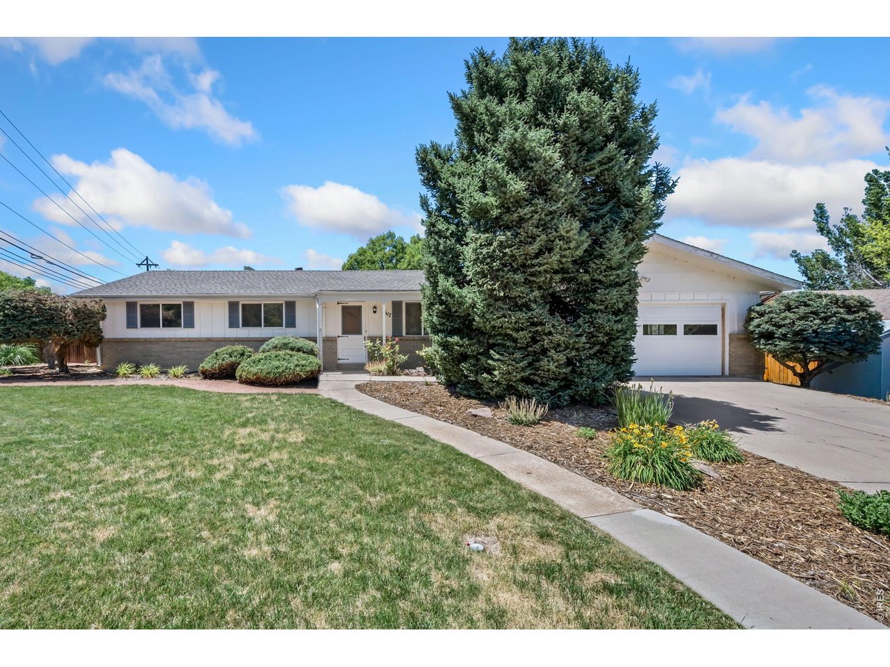 Available for the first time since it was built in 1972, this original-owner ranch offers a rare opportunity to own a home with deep roots in one of Longmont's established neighborhoods. Situated on a beautifully landscaped 0.30-acre lot, the property is filled with mature trees, established perennials, and peaceful outdoor spaces that have been lovingly maintained for decades. The home features a practical ranch-style floor plan with 4 bedrooms, 2 bathrooms, and an unfinished basement ready for future expansion, storage, hobbies, or workspace. While the interior presents an opportunity for updating and personalization, that potential has been thoughtfully reflected in the price. The true highlight is the setting. The fully fenced backyard provides a private garden retreat with ample room to enjoy Colorado's seasons. Just minutes from downtown Longmont and walking distance to Prospect, local restaurants, shopping, parks, and community events, the location also offers convenient access to Longmont's extensive trail and bike path network. Built when Pike Road was still a dirt road and the surrounding area looked very different than it does today, this home has been thoughtfully cared for by its original owners for more than five decades. Whether you're looking to restore its character, renovate to your vision, or simply enjoy an exceptional lot in a desirable location, this is a unique opportunity to create the next chapter of a property with a remarkable history.