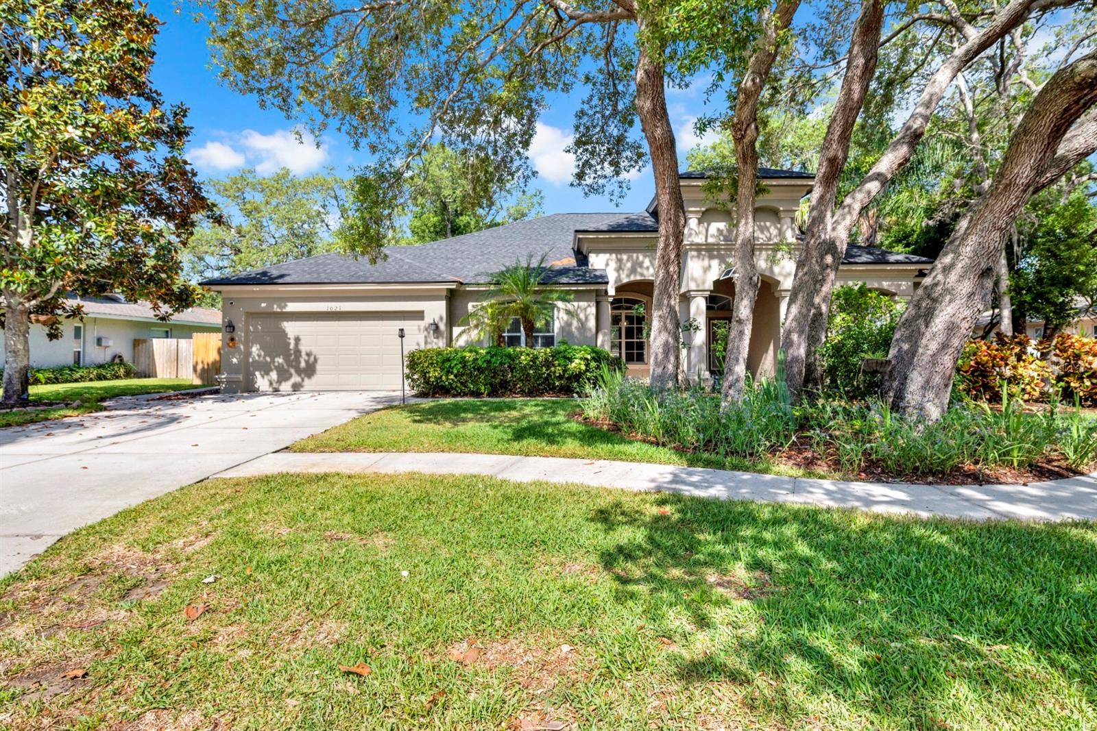 Welcome to this beautifully maintained, thoughtfully designed home in the heart of Tarpon Springs, offering the perfect blend of comfort, style, and functionality. Featuring a highly desirable 3-way split floor plan, this residence provides exceptional privacy ideal for families, guests, or multi-generational living.Step inside to an inviting layout highlighted by soaring ceilings, abundant natural light, a formal dining area, and a spacious great room designed for both everyday living and effortless entertaining. The well-appointed kitchen serves as the heart of the home, showcasing rich wood cabinetry, granite countertops, and newer stainless steel appliances, all seamlessly connected to the main living spaces.The primary suite and secondary bedrooms are strategically positioned to maximize comfort and privacy. Outdoors, enjoy your own private retreat complete with lush, mature landscaping, a charming treehouse, and a storage shed. Unwind in the heated saltwater pool and spa beneath the covered lanai perfect for year-round Florida living.Recent updates, including a new roof, provide added value and peace of mind. Ideally located just minutes from Fred Howard Park, Sunset Beach, and the vibrant shops and dining of downtown Tarpon Springs, this home offers the best of both tranquility and convenience.This is a must see property schedule your private showing today.