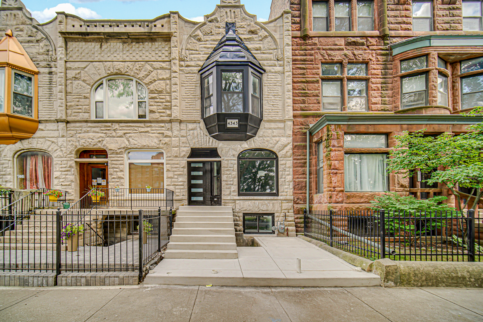 Welcome home to this fully updated 2-story Greystone sitting right in the historic North Kenwood neighborhood. With 4 bedrooms, 3 full baths, 1 half bath and a spacious master suite, this home is designed for both comfort and style.  You'll love the open flow with vinyl flooring throughout, central air to keep you cool, and a finished basement for extra space. The kitchen is the heart of the home-brand-new black stainless-steel stove, fridge, dishwasher, and microwave are all included. Every detail was done with care, blending that timeless Greystone charm with modern updates. And here's the plus: as an owner-occupant in North Kenwood's Historic District, you could qualify for some serious perks-like a property tax freeze, permit cost waivers, and property tax incentives. That means you can own a beautiful historic home and keep more money in your pocket.   This one is move-in ready and won't last long-let's get your showing scheduled today!
