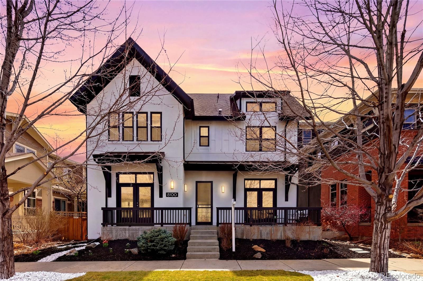 Perfectly positioned overlooking Songbird Park, this fully remodeled Harvard home blends timeless architecture with sophisticated modern design in one of Central Park’s most coveted locations—just moments from the vibrant 29th Avenue Town Center*Reimagined from top to bottom, the home showcases a striking black, white, and natural wood palette. A freshly painted exterior, elegant coach lighting, and a welcoming front porch with park views set the tone for the refined interiors. Inside, refinished light oak floors, designer paint, new carpet, and curated lighting create a cohesive aesthetic across an expansive floorplan featuring 6 bedrooms, a loft, and a main-floor office*At the heart of the home, the designer kitchen pairs white cabinetry with a bold black island, Calacatta Nero quartz, and a Bohemian porcelain backsplash. A premium appliance suite includes brand new Sub-Zero fridge w black onyx panels, Wolf 6-burner range, double ovens, microwave, and custom hood. Open wood shelving and a butler’s pantry with wine and beverage fridge add both style and function*The adjoining living space impresses with soaring 25-foot ceilings, a two-story wall of windows, dramatic wagon-wheel chandelier, and a double-sided fireplace with white picket-fence tile. A main-floor office with French doors opens to the front porch, while a formal dining/living room offers flexibility for entertaining. A thoughtfully designed mudroom with built-in desk enhances everyday living*Upstairs, three secondary bedrooms, a versatile loft, and a luxurious primary suite await. The redesigned primary retreat features a spa-like five-piece bath, soaking tub, and expansive walk-in closet. Secondary baths and the laundry room have been updated for modern convenience*The finished basement adds two bedrooms—one a fully equipped gym—plus a stylish bathroom. Outdoors, enjoy a private yard and patio with sweeping park views*3-car tandem garage with EV charger, new Class IV roof, New Fence, New Landscaping
