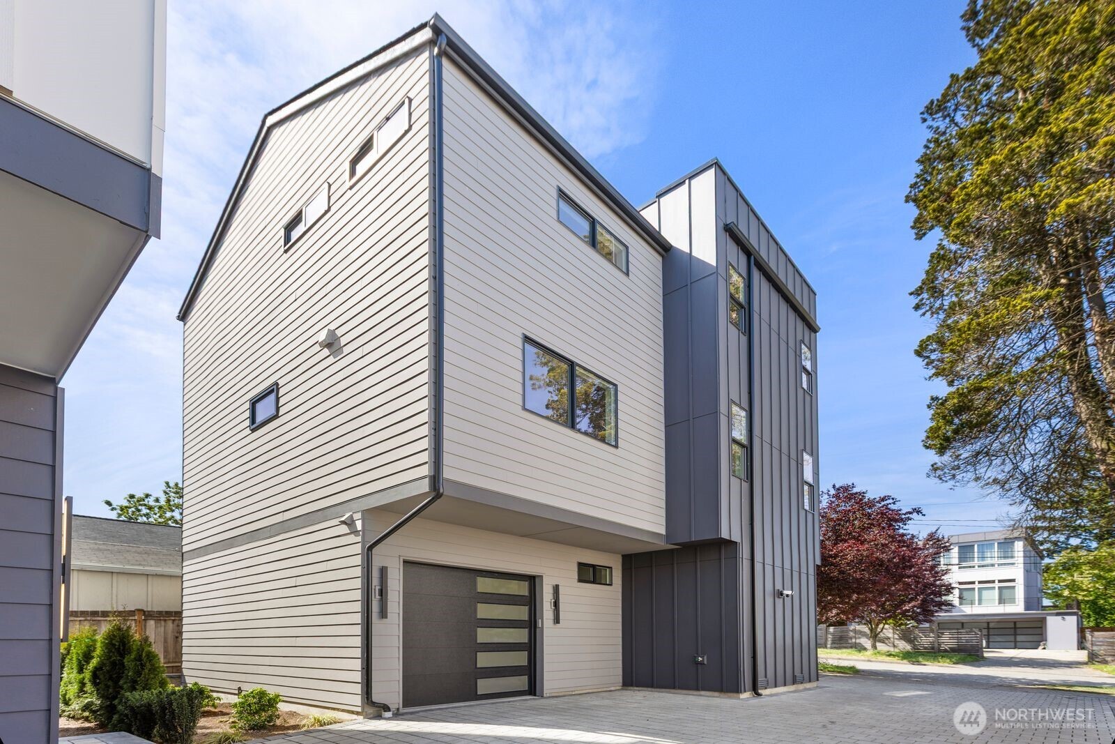 Discover modern luxury in this brand new 3 bed, 3.25 bath home featuring a custom-designed kitchen with premium Bosch appliances, designer finishes throughout, and an inviting electric fireplace. Enjoy seamless indoor-outdoor living with a stunning rooftop deck showcasing breathtaking views of Downtown Seattle, Mt. Rainier, and the Cascade Mountains. Thoughtfully crafted with high-end details, contemporary style, and a spacious 1-car garage, this home is ideally located close to popular shops, restaurants, and everyday conveniences. A rare opportunity to experience elevated city living at its finest.