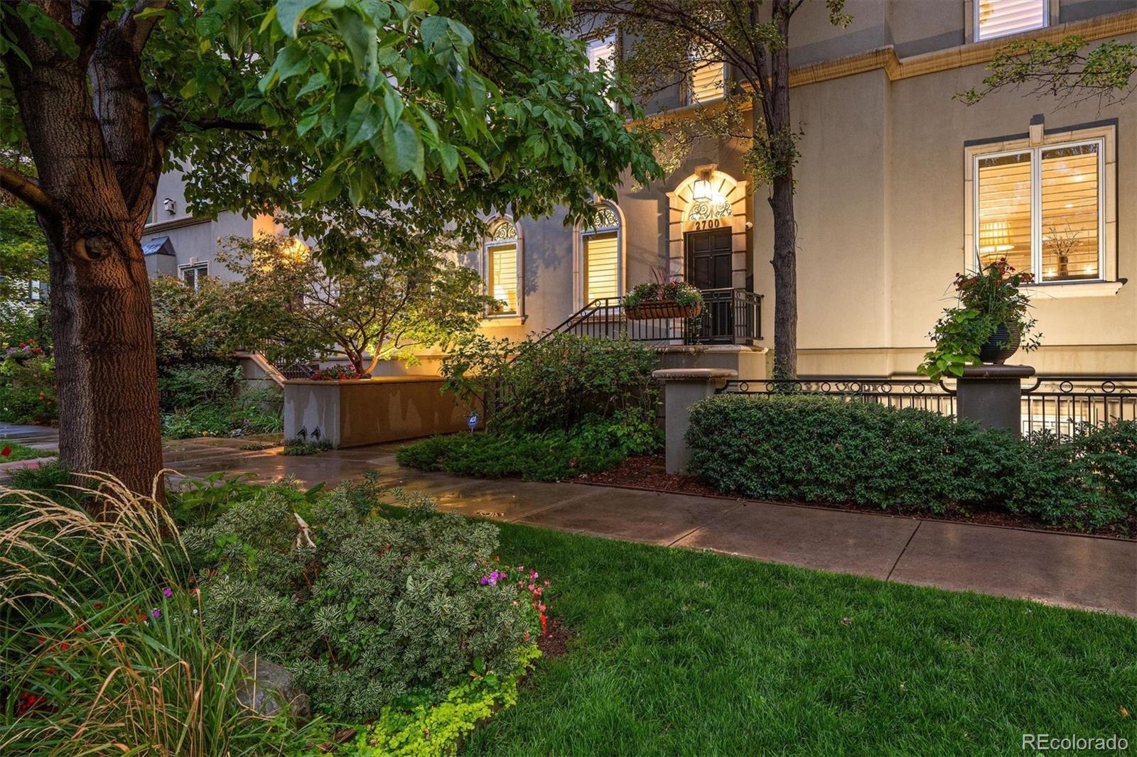 Set on a coveted corner lot along a picturesque, tree-lined street, this exceptional residence offers the privacy, natural light, and feel of a detached home in the heart of Cherry Creek. Three walls of windows fill the interiors with sunlight while maintaining a remarkable sense of privacy. A heated driveway and front steps add year-round convenience, while the dramatic winding staircase creates a striking architectural centerpiece upon entry. Designed for sophisticated entertaining, the main level flows into a beautifully remodeled chef’s kitchen anchored by an expansive Taj Mahal quartzite island, custom cabinetry, panel-ready Sub-Zero refrigerator, gas range with double ovens, and wine cooler. The adjoining covered outdoor living space is equally impressive, featuring a built-in gas grill, ceiling-mounted heaters, TV, and speakers that are all included. Upstairs, the serene primary suite features a gas fireplace and private west-facing deck. The renovated five-piece bath is a spa-inspired retreat with radiant heated floors, a steam shower, elegant finishes, and a generous walk-in closet. A guest suite with full bath, laundry room, and flexible office complete the second level. The showstopping penthouse terrace captures unobstructed mountain views and features a hot tub surrounded by mature trees for exceptional privacy. A third -floor guest suite with full bath and a large flex space provide additional versatility. The finished lower level offers an entertaining area, nonconforming bedroom, 3/4 bath, and storage. Additional highlights include a three-car tandem garage, integrated Sonos and Control4 system with more than 20 built-in speakers, and a home pre-engineered and elevator-ready for future convenience. Steps from the Cherry Creek Arts District, this distinctive residence combines sophisticated design, exceptional indoor-outdoor living, privacy, and effortless access to the best of the Cherry Creek lifestyle.