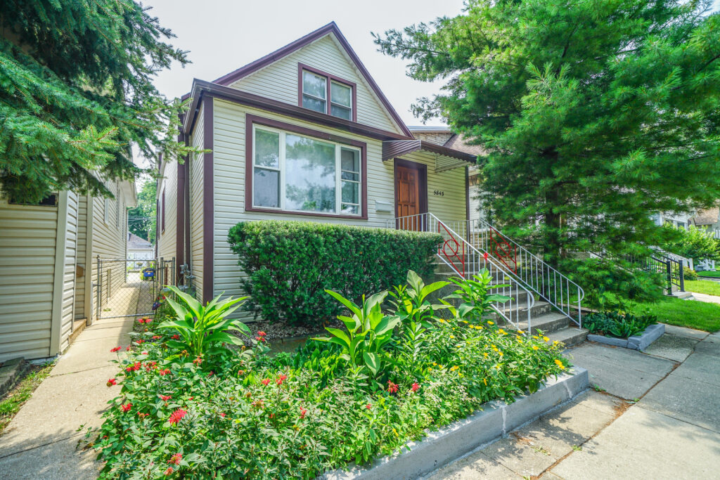 Welcome to this extremely well-maintained 1.5-story bungalow offering 3 full levels of finished living space and 2 in-law arrangements, perfect for extended family or flexible living options. This spacious home features a total of 5 bedrooms and 3 full bathrooms across all levels.  The main floor includes a separate living and dining room, hardwood floors throughout, a large kitchen with maple cabinets, an office, and an enclosed back porch that opens to a spacious wood deck overlooking a beautifully landscaped backyard. The 2nd level offers a private living area with its own kitchen, full bathroom, and 1 bedroom-ideal for guests or extended family. Full finished basement features a separate entrance, 3rd kitchen, family room, 2 additional bedrooms, and a full bathroom. There is also a laundry area, HVAC/mechanical room, and plenty of storage. Additional highlights include central air and heat and a 2.5-car garage. Located on a quiet side street, this is a great opportunity for multigenerational living or investment great property but sold As-Is Condition