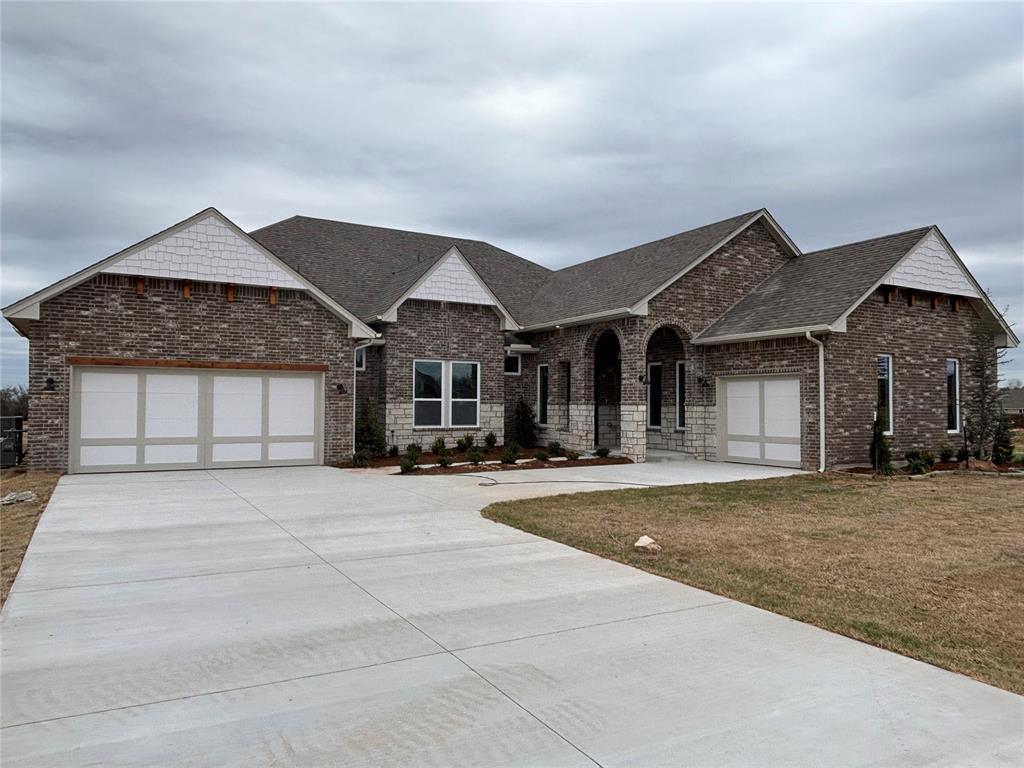 Just a stunning floor plan! You will be impressed the moment you drive up and then again when you walk through the front door! A beautiful wide hallway leads you to the massive living room featuring a wonderful fireplace with attractive built in shelving on either side. Wood tile runs throughout all of the main area. The kitchen is loaded with custom cabinets all the way to the ceiling, a huge island, thick quartz tops, under cabinet lights, floating wood shelving, stainless steel Samsung built-in appliances, a large decorative wood vented hood, huge island and much more! The pantry is amazing with lots of storage and even a sitting place! You will love the 12’ glass sliding doors that telescope open to the very large covered back patio. The primary bedroom is an oasis away from it all and has a quaint loggia running from the primary bathroom to the primary bedroom’s very own study, or personal space. The primary bathroom is beautiful with a large free standing tub, spacious walk in shower and roomy two sink vanity, enclosed water closet and tons of storage. Very large primary closet with window. So many details to this home! Outbuilding friendly!