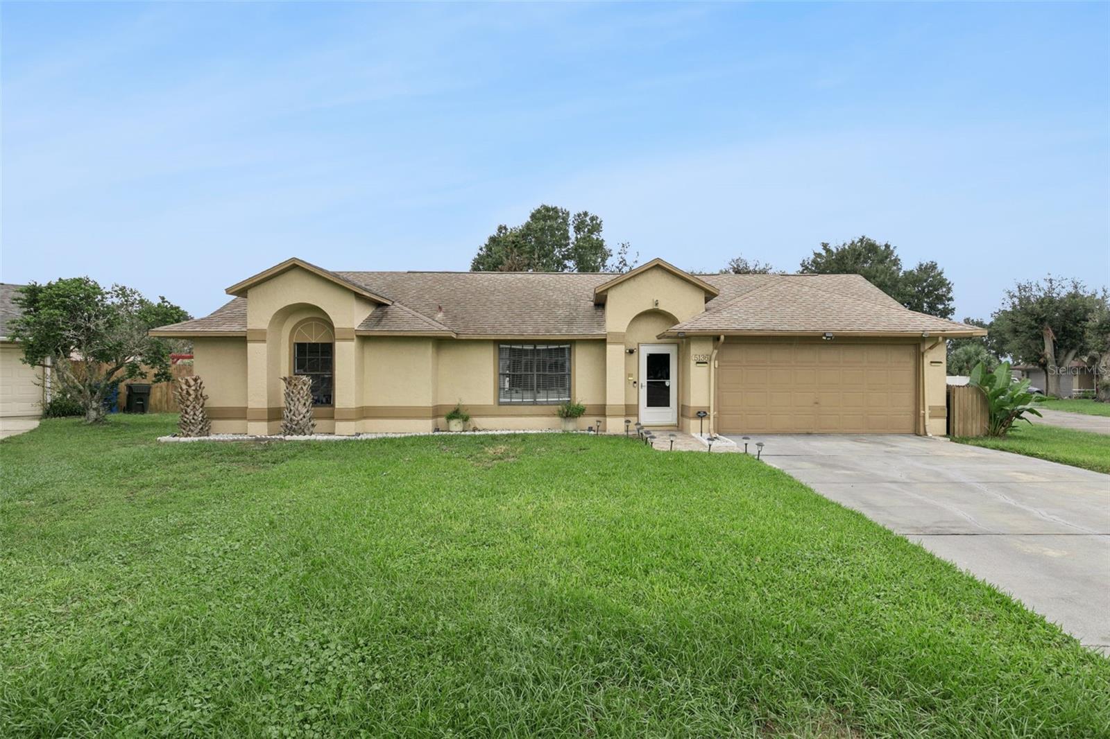 **NO HOA | 3 BEDROOMS | 2 BATHROOMS | 2-CAR GARAGE | RENOVATED INTERIOR | QUARTER-ACRE LOT!** Welcome to 5136 Timber Ridge Trail in Ocoee, Florida, where modern upgrades, comfortable living, and an excellent Central Florida location come together. Priced at $399,900, this beautifully updated, east-facing home offers 1,732 square feet of living space, a spacious quarter-acre lot, and an inviting floor plan designed for everyday comfort and entertaining.Step inside to discover abundant natural light, gorgeous porcelain tile flooring throughout with NO CARPET, and fresh interior paint. The thoughtfully designed layout includes formal living and dining rooms, a spacious family room, and a casual dining area adjacent to the kitchen, providing plenty of flexibility for gatherings, entertaining, or simply relaxing at home.The renovated kitchen features beautiful modern cabinetry, high-end quartz countertops, stainless steel appliances, and a custom backsplash. Both bathrooms have been tastefully remodeled with quality finishes, including a spa-inspired primary bathroom. The generous primary suite offers a spacious retreat with a redesigned custom closet completed in 2024, while two additional bedrooms provide flexibility for guests, a home office, or hobbies.Notable improvements include upgraded flooring completed in 2022, smart home features added in 2023, a Bluetooth-enabled HVAC system replaced in February 2023, a NEW WATER HEATER in 2026, and solar panels installed in 2021. Additional recent maintenance includes septic system servicing and certification in 2026, offering buyers valuable information about the home's upkeep.Outside, enjoy a spacious backyard with room for outdoor entertaining, recreation, gardening, or creating your own private oasis. The quarter-acre lot provides space to enjoy Florida's beautiful weather, while the attached 2-car garage adds everyday convenience.Located in an established, peaceful Ocoee neighborhood with NO HOA, this home offers convenient access to Downtown Orlando, Winter Garden, Winter Park, Apopka, and Dr. Phillips. Enjoy nearby walking and biking trails, shopping, restaurants, and convenient access to major roadways, including Florida's Turnpike.Whether you're looking for an updated home, a functional floor plan, a generous backyard, or a convenient location near Orlando, 5136 Timber Ridge Trail offers an exceptional opportunity to enjoy the Central Florida lifestyle. **Schedule your private showing today!**
