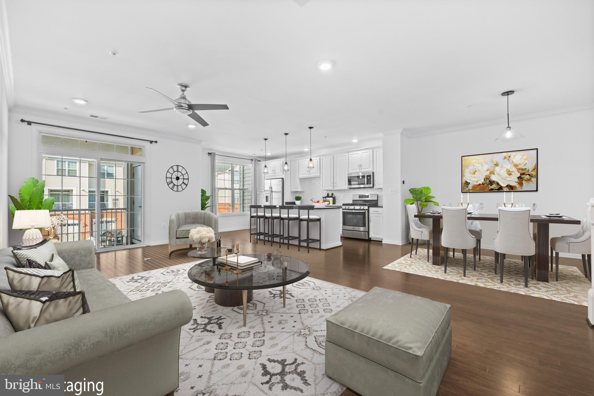 Welcome to this  charming 2 bedroom, 2.5-bath Toll Brothers condo with an attached one-car garage.Built by Toll Brothers, this home offers exceptional quality and thoughtful design throughout. The open-concept great room showcases beautiful hardwood floors and provides access to a covered porch — perfect for relaxing or entertaining.The spacious kitchen is truly the heart of the home, featuring crisp white cabinetry, granite counter tops, backsplash, a large center island with pendant lighting, a pantry, and ample prep space for any home chef. A convenient powder room completes the main level.Upstairs, the primary suite offers a private retreat with an en-suite bath and a walk-in closet outfitted with custom Elfa shelving and organizers. The secondary bedroom also features a custom Elfa-fitted walk-in closet and is served by a full hall bath. For added convenience, the washer and dryer are located on the bedroom level. Hardwood flooring continues upstairs, adding warmth and continuity.Additional highlights include a long driveway accommodating two cars, ceiling fans, and freshly painted walls throughout.Ideally situated between Brambleton Town Center and the Ashburn Metro Station, this home offers easy access to shopping, dining, and major commuter routes. Residents enjoy a beautifully landscaped community with resort-style amenities including three clubhouses, pools, party rooms, fitness centers, basketball and tennis courts, and scenic walking trails.Close to Dulles Airport and major commuting routes — don’t miss this opportunity.