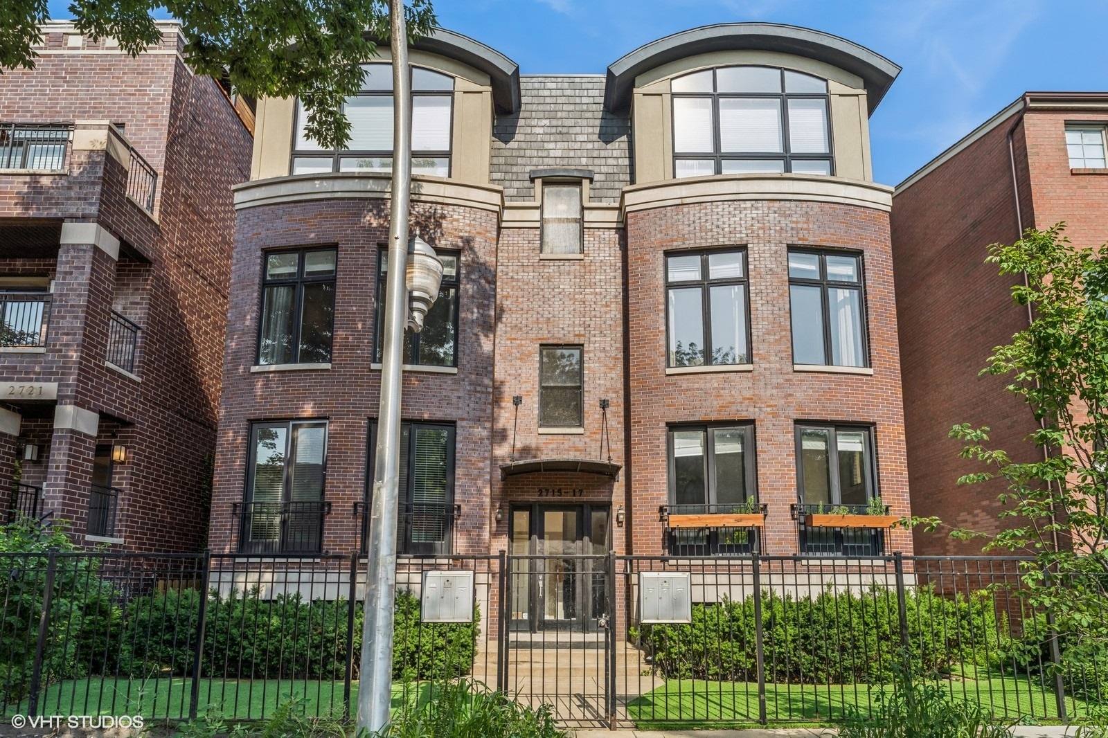 Located in a prime Lincoln Park location, this stylish and meticulously maintained 2BD/2BA residence is filled with custom details and designer finishes throughout. The expansive layout is anchored by a stunning living room with floor-to-ceiling windows that flood the space with natural light, complemented by a gas fireplace. Custom wall coverings, detailed millwork, and high-end lighting elevate the overall aesthetic. The beautifully appointed kitchen features stainless steel appliances, granite countertops, sleek high-gloss cabinetry, and an oversized pantry-combining functionality with elegance. Both bathrooms are thoughtfully finished with timeless fixtures and sophisticated touches. The spacious primary suite includes a massive walk-in closet with custom organizers, a private deck, and a spa-like ensuite with a soaking tub. Hardwood floors run throughout, paired with custom window treatments and abundant storage. Professionally designed details-from wallpaper accents to crown molding-make this home truly one of a kind. Tandem parking for two cars and a large, climate-controlled 9x8 storage room are also included. Ideally situated near shopping, dining, parks, and transit in one of Chicago's most sought-after neighborhoods.
