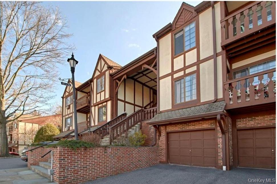 Beautiful Foxwood Condominium is set amid a picturesque, park-like setting with meticulously maintained grounds. This spacious, well-located unit welcomes you with an entry foyer and coat closet. The galley kitchen offers abundant cabinetry and counter space and opens to a dining area with sliding glass doors leading to a private balcony overlooking serene, wooded views. The expansive living room provides excellent space and features two double-door closets. The primary bedroom includes a walk-in closet and an en-suite bathroom. A second bedroom, full hall bath, and convenient laundry room complete the layout. Additional highlights include an attached one-car garage, private driveway, guest parking, and a secure basement storage cubicle. Heat and hot water are included in the common charges. Enjoy community amenities, including a pool, an outdoor lounge area, and restrooms. Ideally located near the charming Village of Mount Kisco with shopping, dining, schools, library, Metro-North train station, parks, recreation, quick access to major highways, and an easy NYC commute.