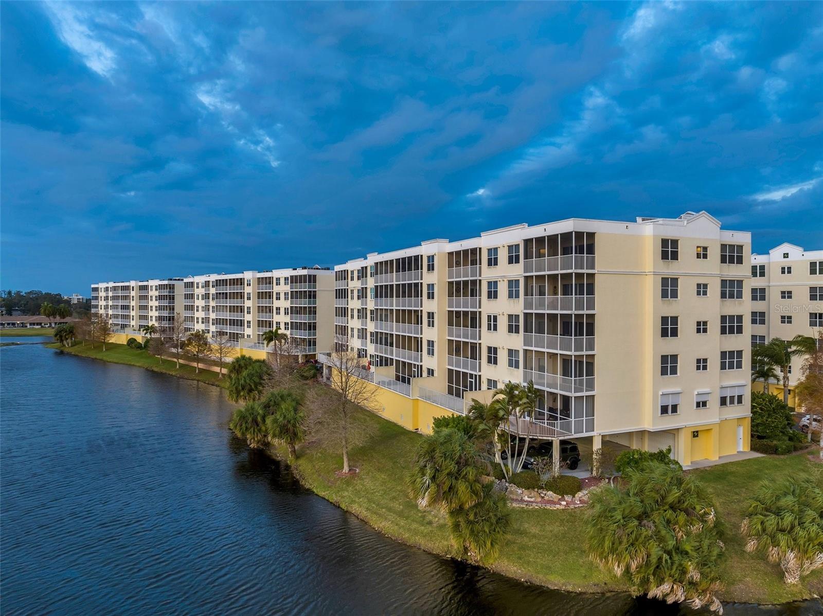 *******************************************************************************************************************HERE READY & WAITING FOR YOU IS a one-careful-owner-since-new high quality private and peaceful luxury home. SEE PANORAMIC peaceful private views of lakes and green space, with wonderful wildlife sightings here, there and everywhere. EXPERIENCE 100's of fabulous Florida 180 degree sunsets every year.  MAGICAL beauty and each unique as the sun slowly melts with skies-ablaze color. THEN STARLIGHT & MOONLIGHT superb night views with water reflections you will love. PEACEFUL & PRIVATE - at night open your bedroom windows and screened balcony door for the wonderful sounds of nature. *****************************************************************************************************************DESIRABLE  3-bedroom, 2-bathroom condominium offering interior open-concept living room floorplan. Sliding glass doors from living room & main bedroom to the wide peaceful private screened balcony. WORK REMOTELY from this your golf front home office. Total 1,703 Sq Ft including lanai, 1,576 sf heated and air conditioned. MODERN convenience is built-in all around with full-sized washer & dryer.  1404 has over-sized under-building private garage 6 with remote garage door opener close to elevator and mailboxes. *****************************************************************************************************************BEAUTIFUL RESORT-STYLE clubhouse, landscaping & landscape lighting are recently renovated - full kitchen, lounge, private meeting room heated pool & inground spa are beautiful day & night. LIFESTYLE - low stress, resort-style living without age restrictions as a year round home or for part year living. PET FRIENDLY for owners with two 25lb pets welcome.  *******************************************************************************************************************SIX BUILDING COMMUNITY with 30 condos per building, 10 2-BR, 10 3-BR Center, 10 3BR Corners. COUNTRY CLUB ONE is the best of the best buildings here with unique bedrock end bearing pilings. DURABLE SOLID SAFE all-concrete superstructure, cast in-situ post-tensioned concrete floors and roof, concrete block walls exterior and dividing walls between condos. NO LUMBER no termite issues. STANDING STRONG after many hurricanes & tropical storms. MILESTONE Inspection - SIRS Report – Fully compliant. Regularly re-roofed, re-sealed & re-painted. NON EVACUATION zone location.  NO CONCERNS about structural milestone inspection nor SIRS (Structural Integrity Reserve Study). THIS FINE BUILDING is looked after by professionals. FISCALLY & PHYSICALLY well managed and maintained by a proactive 2-level HOA with well-funded reserves (Master HOA Board + Building One HOA Board.  HOA DUES are $   and cover a lot: Cable, Internet/Wi-Fi, Water, Sewer, Trash removal, upkeep of common areas and building exterior. ****************************************************************************************************************** ENJOY RELAXING SWEEPING 180-degree Million Dollar views of sunsets over spring-fed waters and lush green fairways framed by pines and palms.  HERE IS YOUR CONDO OPPORTUNITY #1404 has much to offer buyers, family, friends, visitors for all to enjoy. SUCH GREAT VALUE!! Please call or text Broker Steve ILES anytime for private showing.