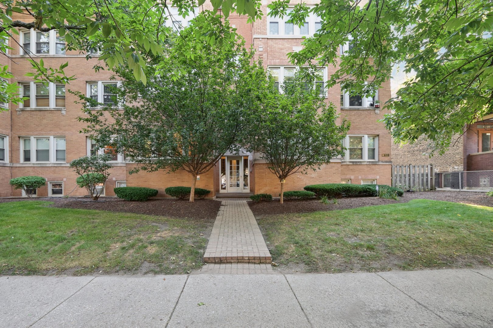 Welcome to this light-filled 4 bedroom, 2 bathroom duplex down nestled in the coveted Southport Corridor. Set in a charming 1940s building, this home blends historic character with modern updates for comfortable city living. The first floor includes the kitchen with brand new stainless steel appliances, large dining and living area, full bathroom, and 2 bedrooms. Step into the lower level with 2 bedrooms, a second living room, full bathroom, and a bonus office space.   The Southport Corridor offers vibrant shopping, dining, and entertainment options, all just steps from your door.    Commuting is a breeze with close proximity to both the Red and Brown Lines, and the 22/Clark bus right outside. You're also just a short walk from Wrigley Field, yet tucked away on a quiet, tree-lined street for peaceful living.    Located in the highly rated Blaine Elementary School district. Reach out to the listing agent if you have any questions. Fact sheet available in the additional info.