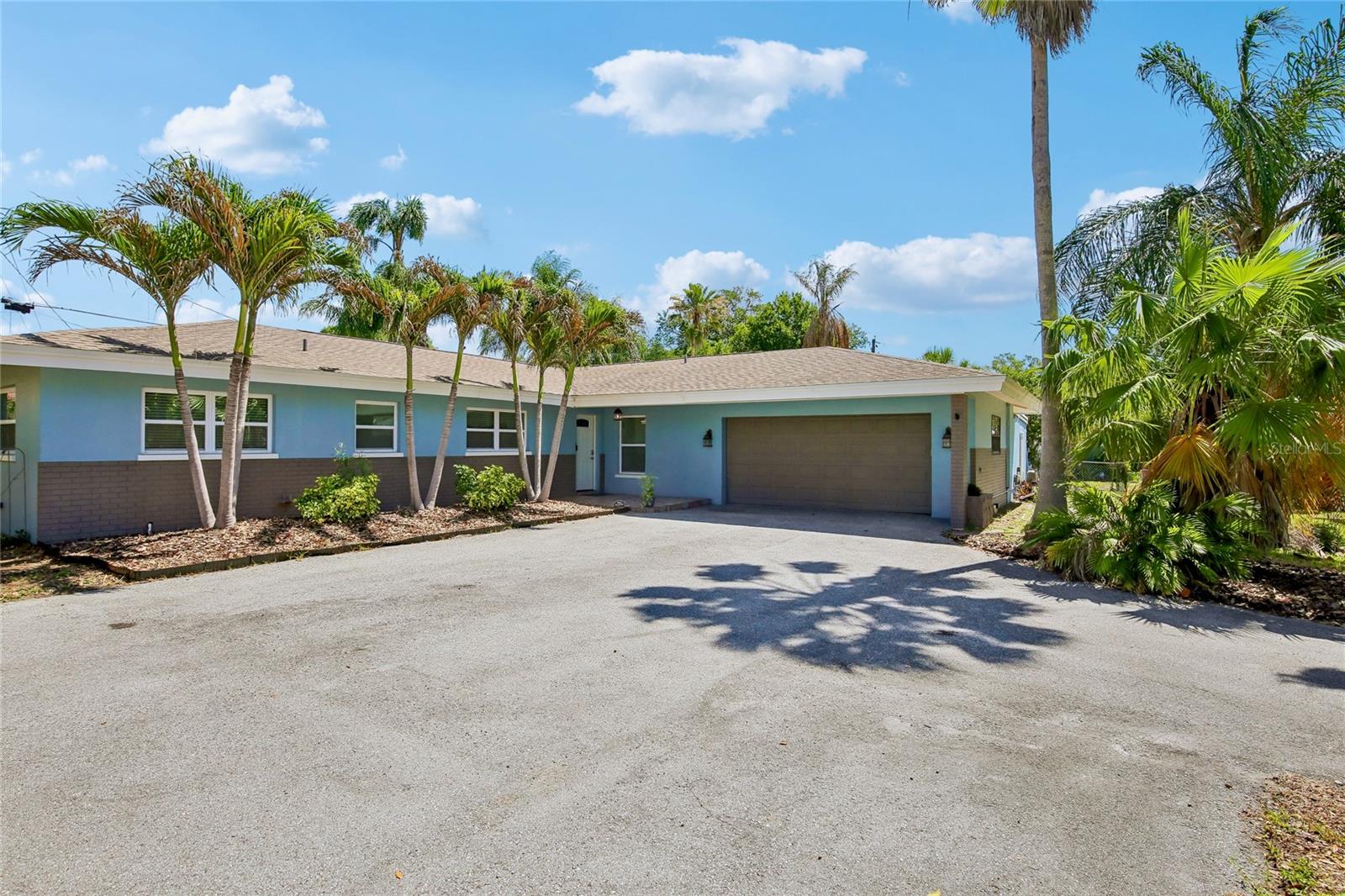 One or more photo(s) has been virtually staged. Private pool + fenced backyard • 2,682 sq ft single-story layout • 2020 roof + 2025 HVACRemodeled in 2020, this 4-bedroom, 3-bath Clearwater pool home offers 2,682 sq ft of single-story living with an in-ground pool, surrounding pool patio, fenced backyard, separate wood side deck and mature tropical landscaping. The split-bedroom floor plan includes open living and dining areas, an updated kitchen, a large bonus room and flexible bedroom separation. The kitchen features granite countertops, white cabinetry, stainless appliances, island cooktop, range hood, breakfast bar seating, recessed lighting and generous prep space. The primary suite includes a huge walk-in closet, and the floor plan adds interior laundry, storage, updated baths and a separate bedroom/bath wing near the bonus room. Use the bonus room for office, fitness, media, studio, game room or guest space without giving up the main living room. Outdoor features include an in-ground pool with surrounding patio space, a separate wood side deck, fenced backyard, covered front porch and mature tropical landscaping. Major system updates include roof installed in 2020, HVAC in 2025, water heater in 2025 and pool pump in 2020. Smart-home features include a Nest thermostat, video doorbell and security system with cameras. Centrally located in Clearwater’s Douglas Manor area near Plumb Elementary, Oak Grove Middle, Clearwater High, US-19, Gulf to Bay Blvd and the Clearwater Mall dining corridor. For everyday dining and errands, the home is close to Clearwater Mall, Mellow Mushroom, Carrabba’s, Smokey Bones, Joe’s Crab Shack, Lenny’s Restaurant and Abe’s Place. BayCare Ballpark, home of Phillies spring training and Clearwater Threshers baseball, and Ruth Eckerd Hall for concerts and events are also nearby. For beach days, parks and local events, the location offers convenient access to Clearwater Beach, Safety Harbor Main Street, downtown Dunedin, Philippe Park, Dunedin Causeway and Honeymoon Island State Park, about 11 miles away. Floor plan available in listing media.