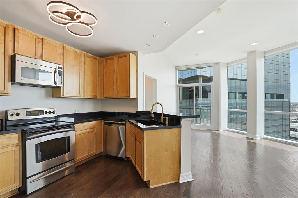 Warning: Living at 500 Throckmorton Street #1108 may result in spending significantly less time in your car, significantly more time enjoying Downtown Fort Worth and getting valuable time back in your day. This FABULOUS 1-bedroom, 1-bath condominium offers 972 square feet of smartly designed living space that's perfect for anyone who believes weekends should be spent exploring—not mowing the lawn.Inside, the open-concept layout makes the most of every square foot, with a spacious living area that's equally suited for hosting friends or binge-watching your favorite series without judgment. The kitchen features granite countertops, stainless steel appliances, ample cabinetry, and a breakfast bar that's just as ready for morning coffee as it is for takeout tacos. The generously sized bedroom offers a peaceful escape with a walk-in closet roomy enough to support your online shopping habits.Are you still gainfully employed? If you answered yes, #1108 is for you because you have 2 office areas (or 1 office and 1 gaming area- if you are that type of person) OR you can out a twin bed in the room for a guest area. When you're ready to venture out, leave the car parked. You're just steps from Sundance Square, fantastic restaurants, live entertainment, coffee shops, and nightlife. Prefer to stay home? Enjoy luxury amenities including a resort-style pool, fitness center, firepits secure access, and covered parking. YES! You have your own 24-7 concierge! Whether you're looking to get simplified in life, become a frequent traveler, or simply ready to trade yard work for happy hour, #1108 delivers the perfect blend of comfort, convenience, and urban fun. Because life's too short to spend it sitting in traffic when you could be living in the middle of it all. This condo is the perfect staple for your new life!